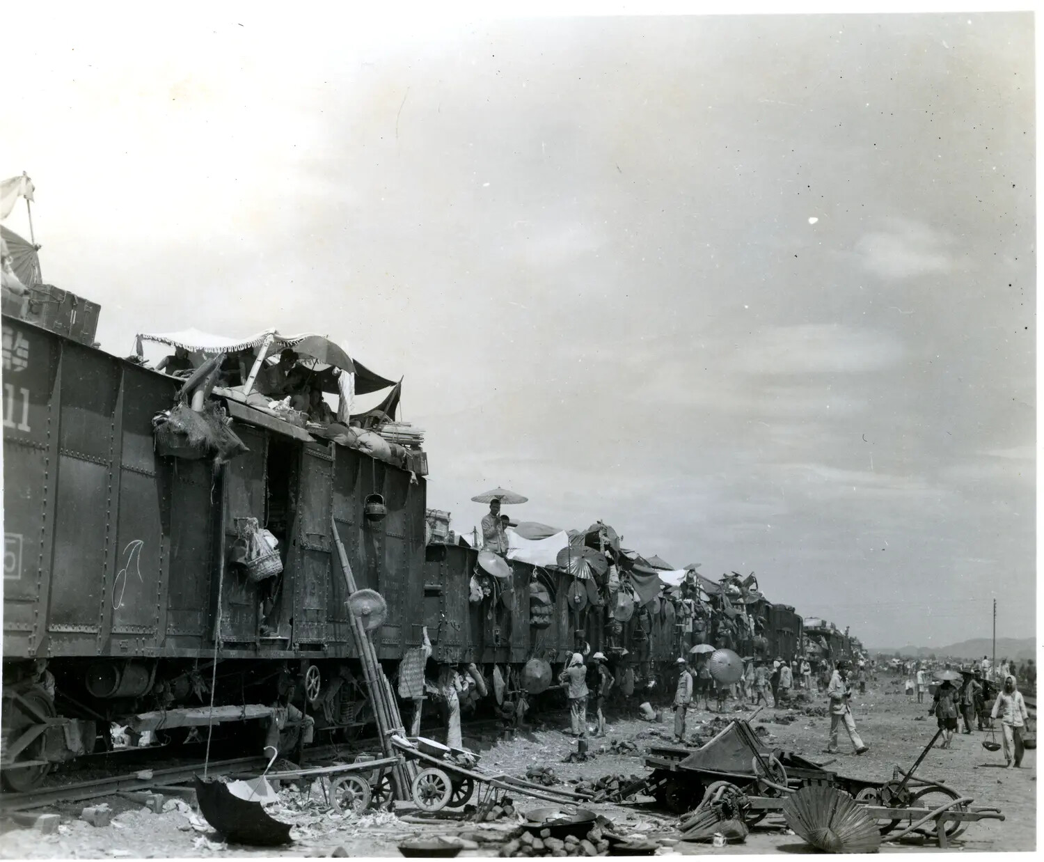 Refugees Atop Freight Train Cars, China — WWII China-Burma Theater Archive