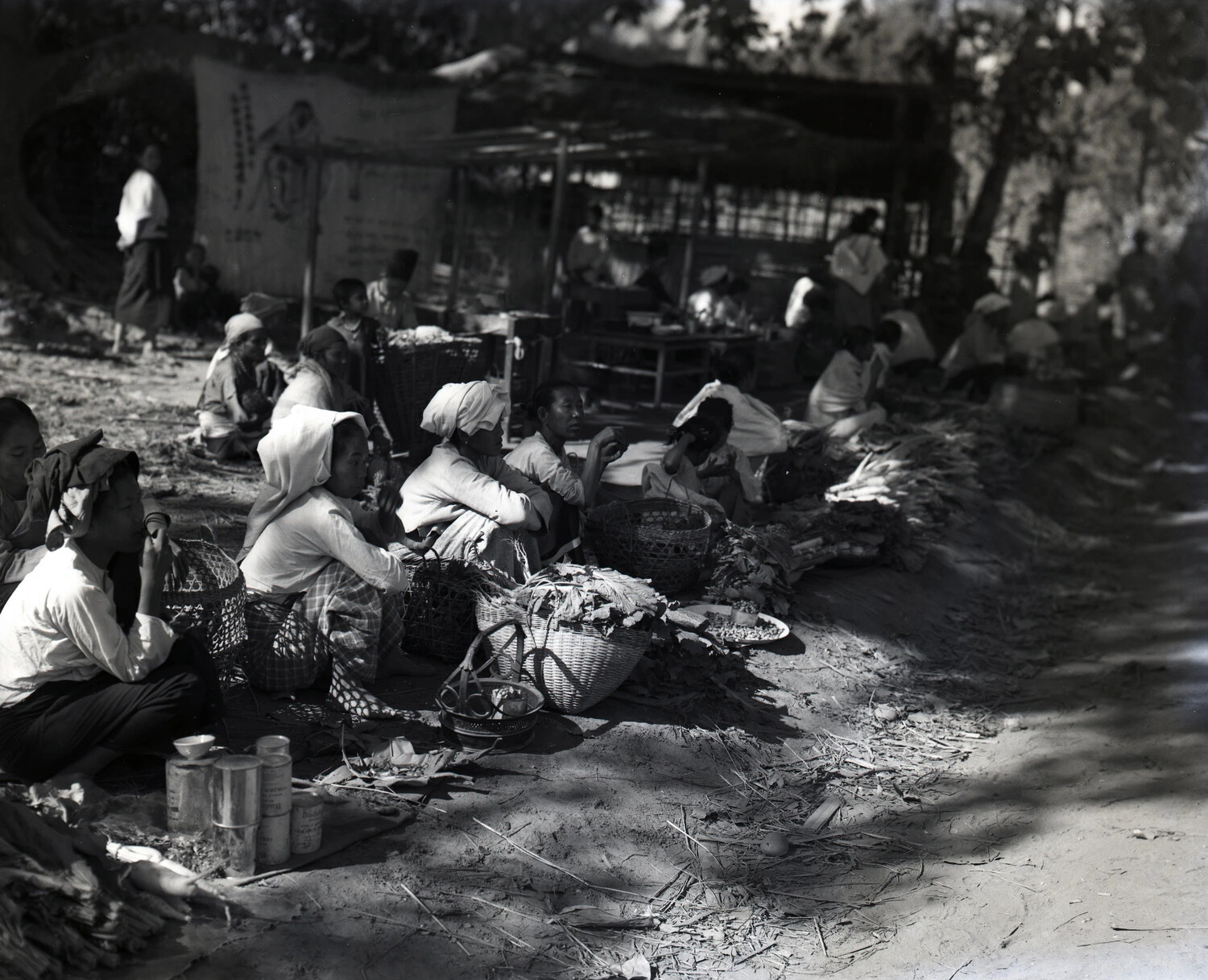 Local Market Scene with Vendors and Produce Baskets, China-Burma Theater, WWII Era
