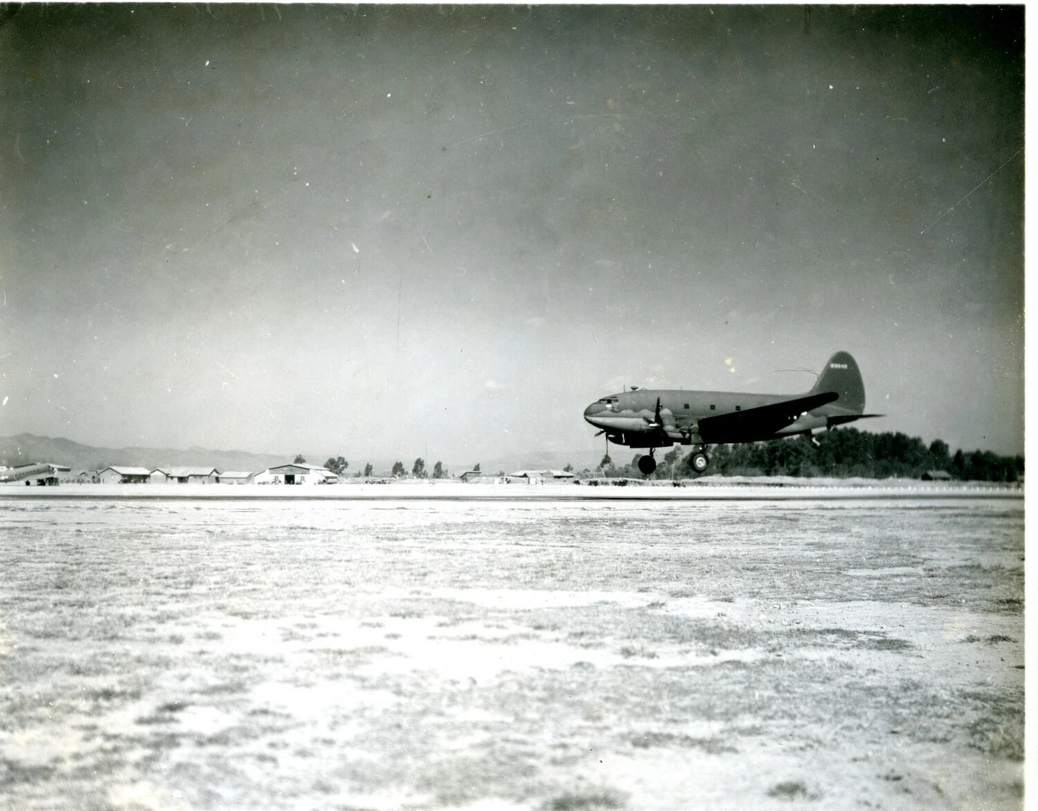 Curtiss C-46 Commando Transport Landing at Airfield, China-Burma-India Theater, WWII