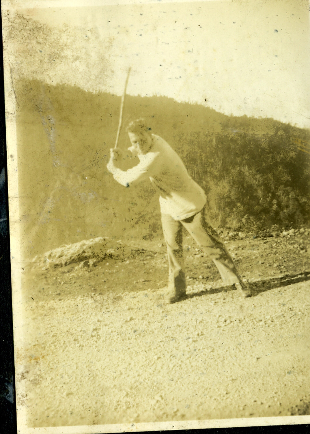 Man Swinging a Bat on an Open Field, Manila Photo Album