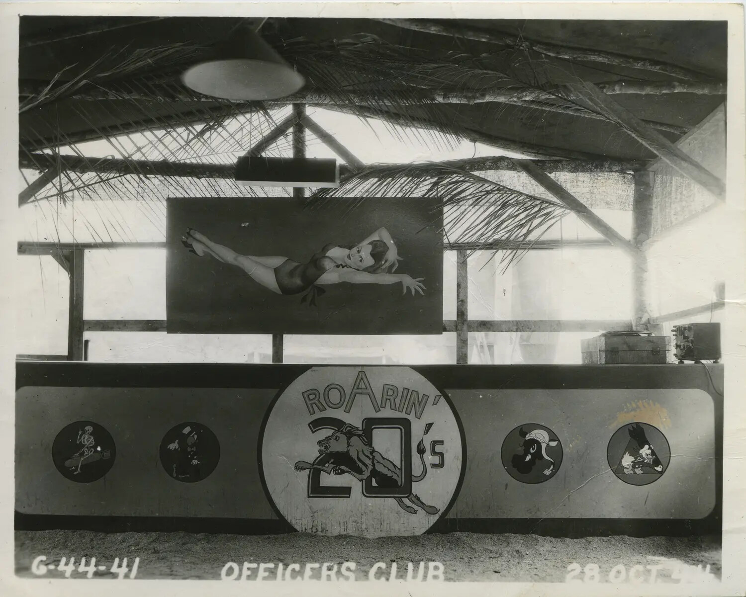 "Roarin' 20's" Squadron Officers' Club Bar with Nose-Art Insignia, 312th Bomb Group, 28 October 1944