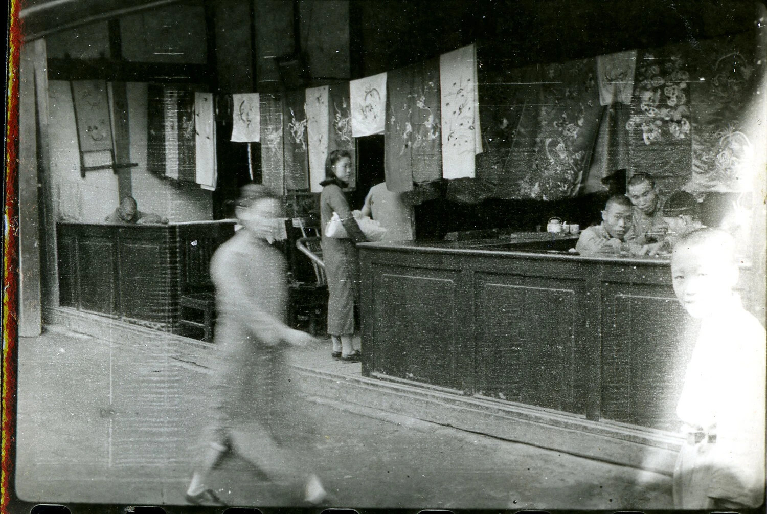 Interior View of a Shop with Hanging Silk Scrolls, Burma-China-India Theater, WWII Era