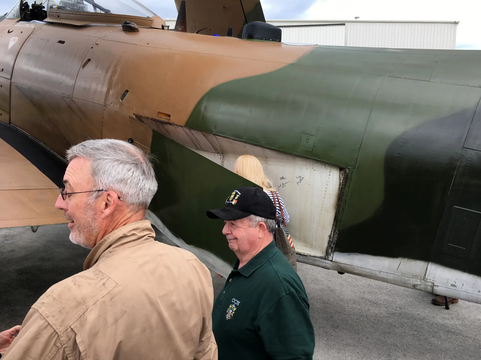 Veterans Examine Restored Vietnam-Era Attack Aircraft with Signature Panel, Reunion Event