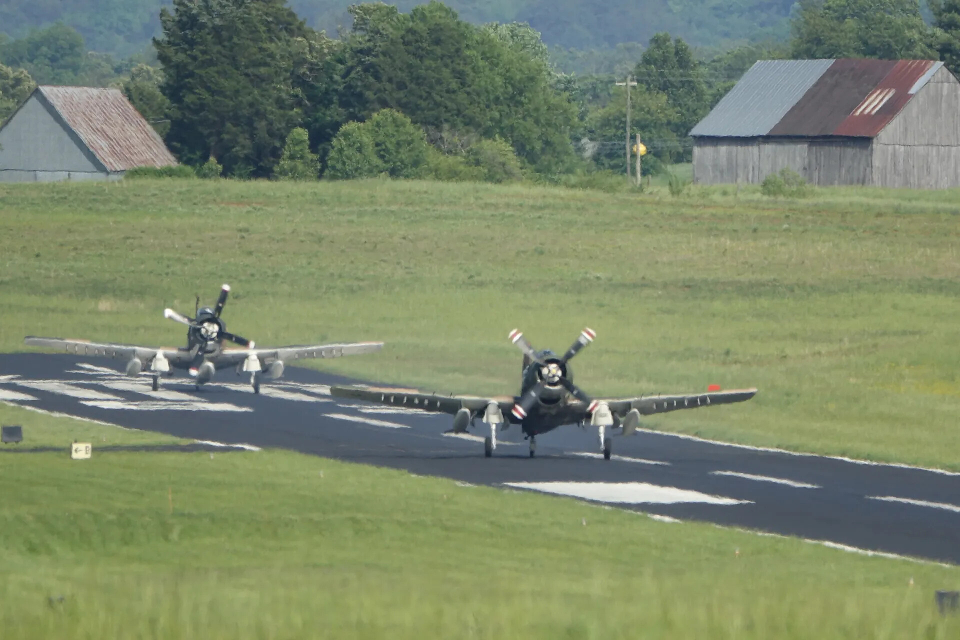 Pair of A-1 Skyraiders Taxiing at Rural Airfield, May 2019 Event