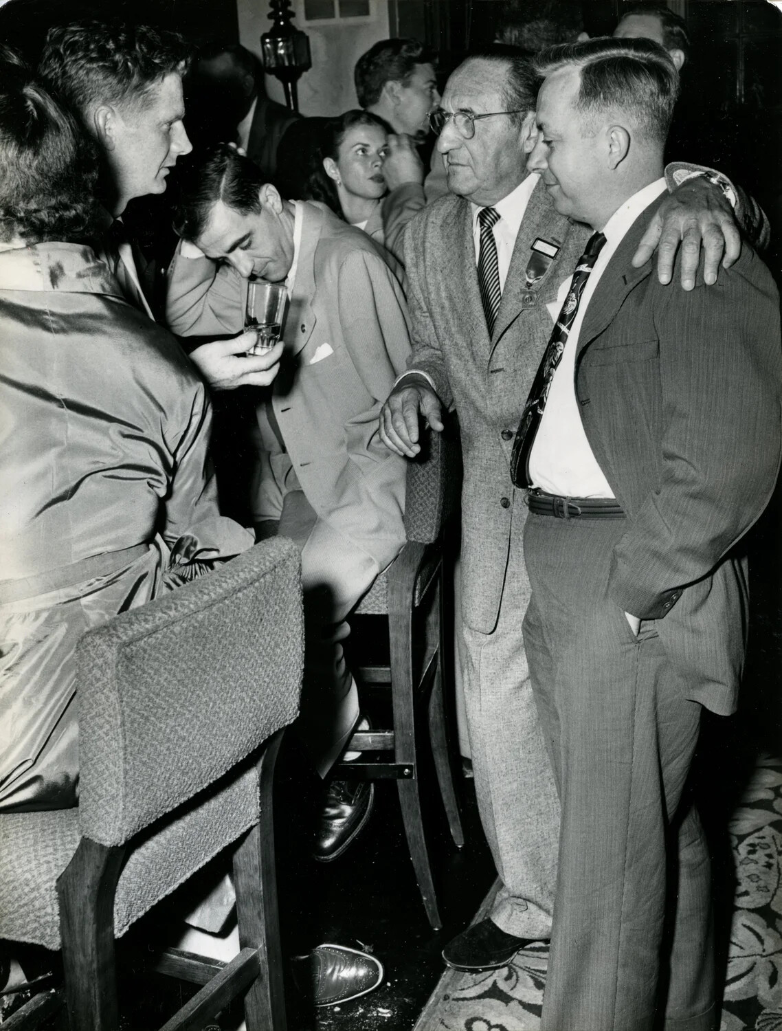 Crowded Hotel Lounge Scene with Central Figure and Attendees, Late 1940s Convention