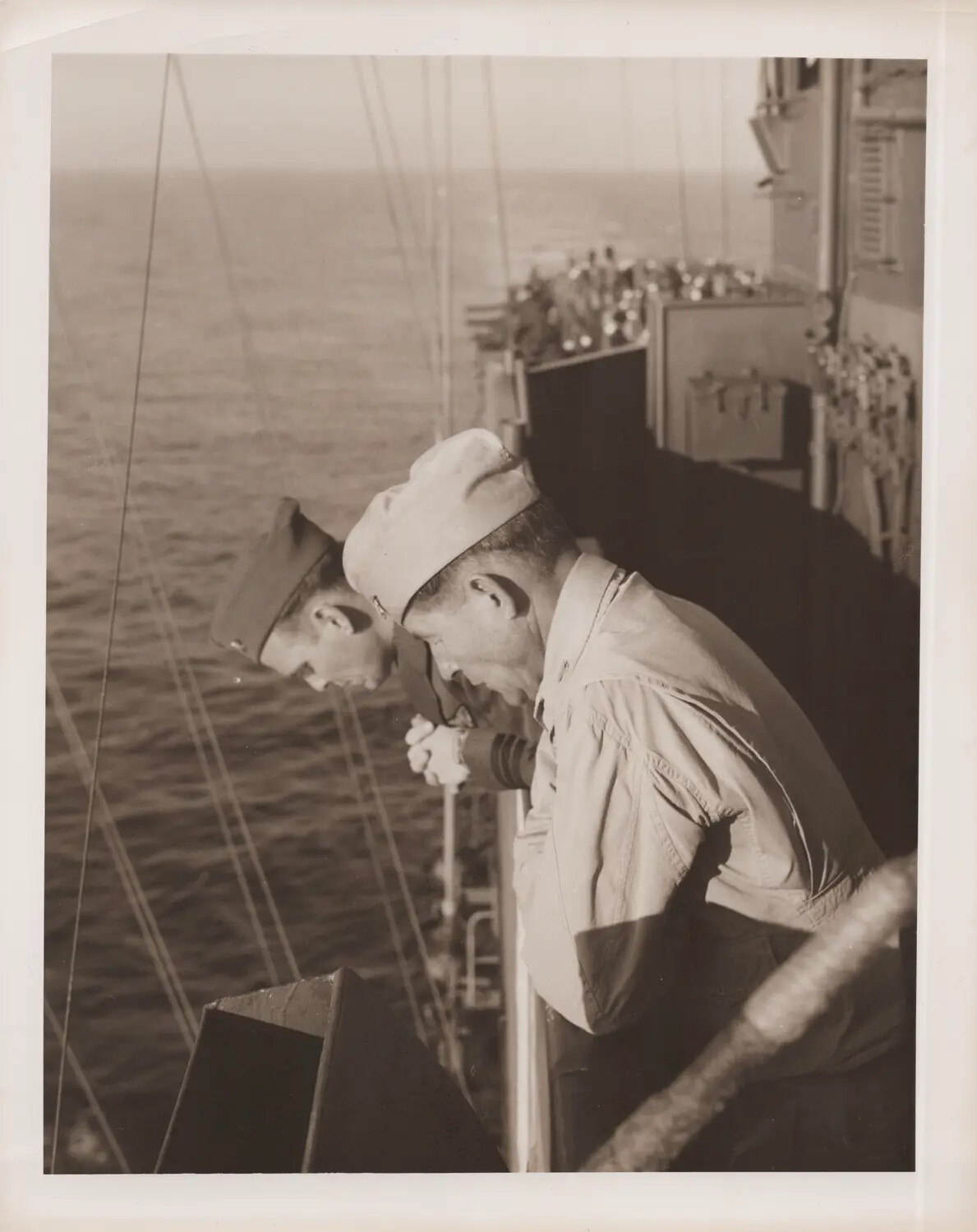 Sailors Leaning Over Ship's Rail at Sea, WWII Era
