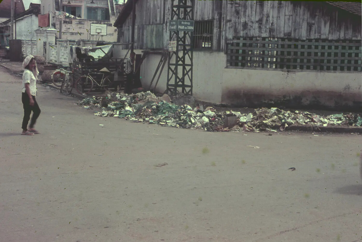 Street Scene with Roadside Refuse — South Vietnam, Mid-1960s