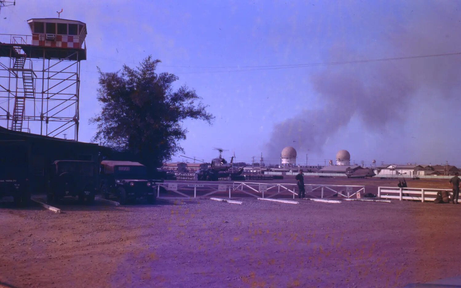 U.S. Air Base During the Tet Offensive, 1968 -- Control Tower, Radar Domes, and Smoke Plume, Vietnam