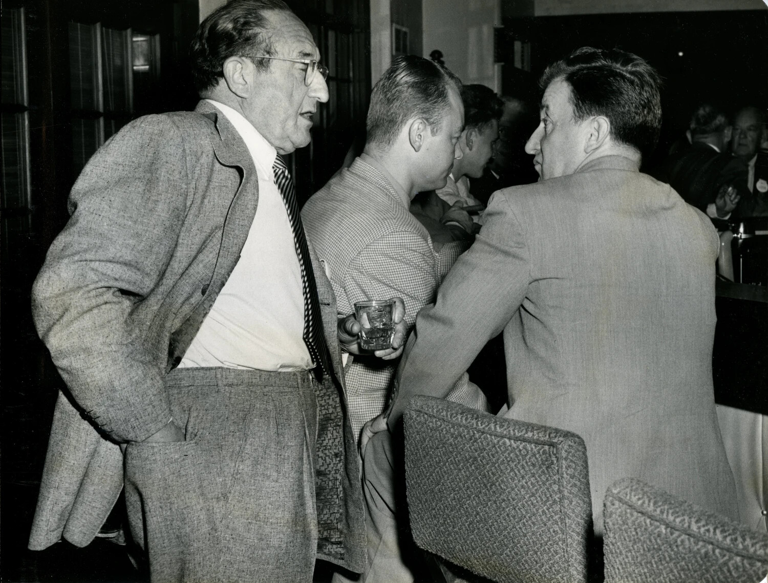 Convention Attendee in Tweed Jacket Conversing at Hotel Lounge Bar, Late 1940s