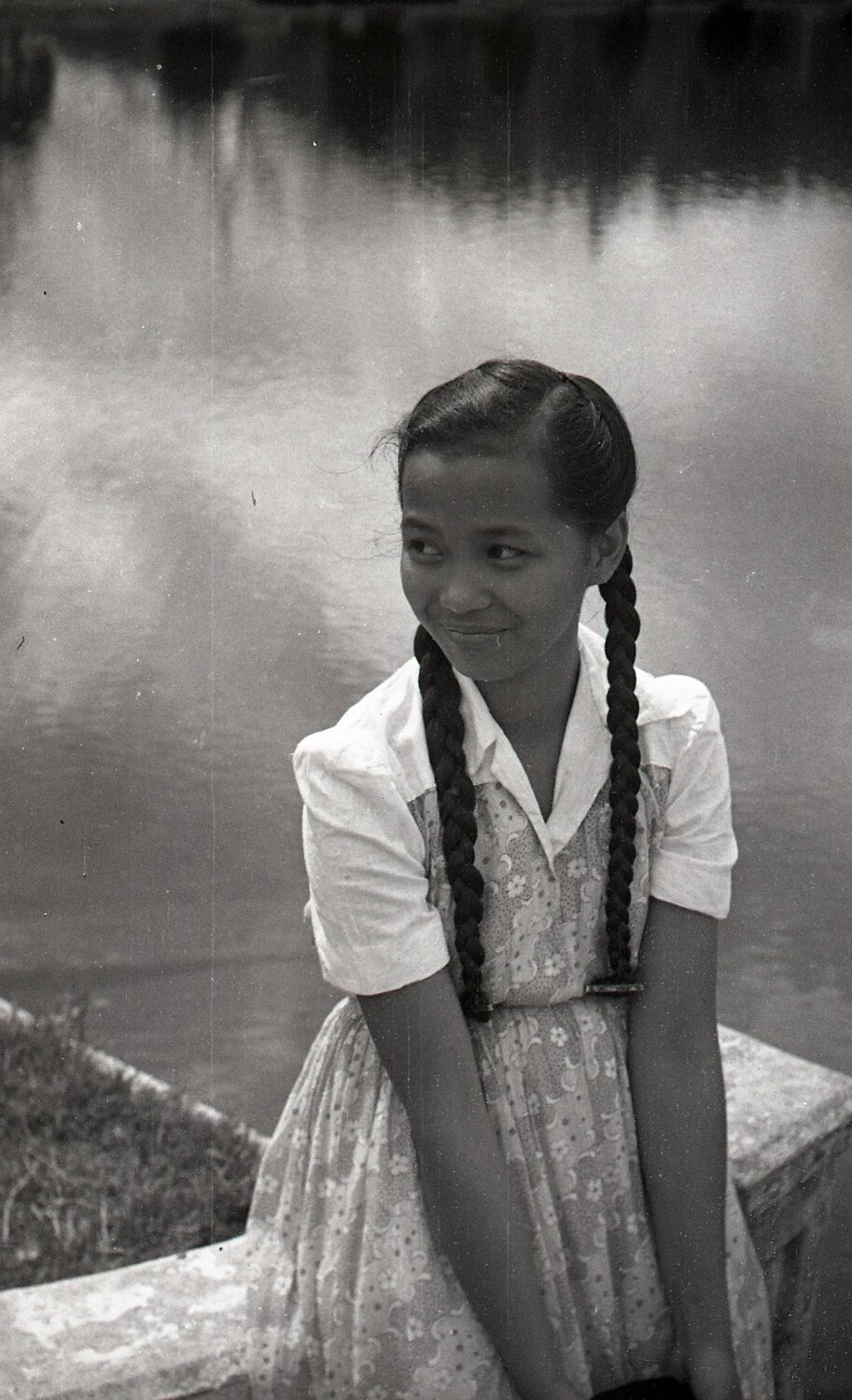 Portrait of a Young Woman with Braided Hair by a Lake, Luzon, Philippines, Mid-20th Century