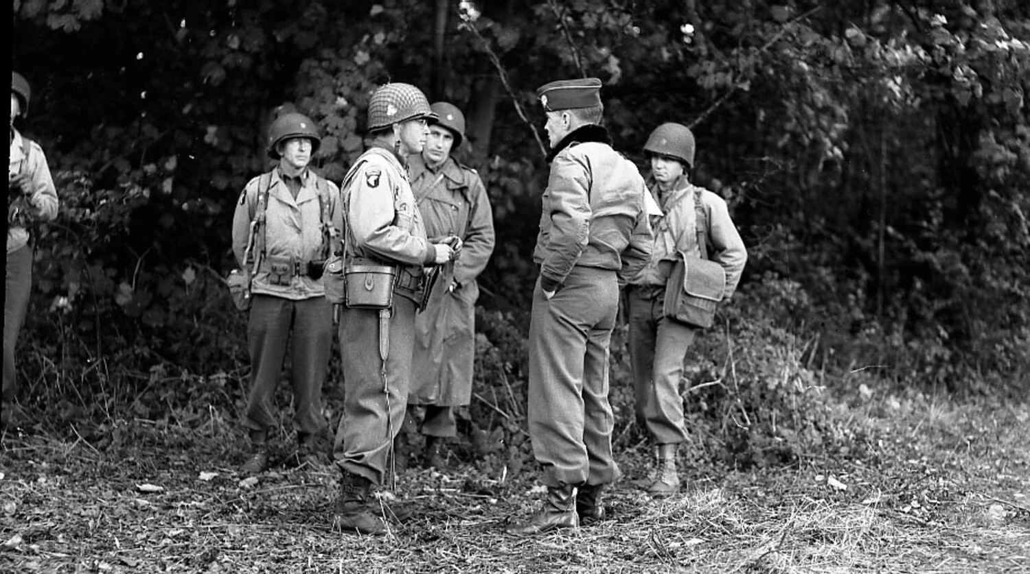 101st Airborne Division Paratroopers Conferring with Senior Officer at Tree Line, European Theater, WWII