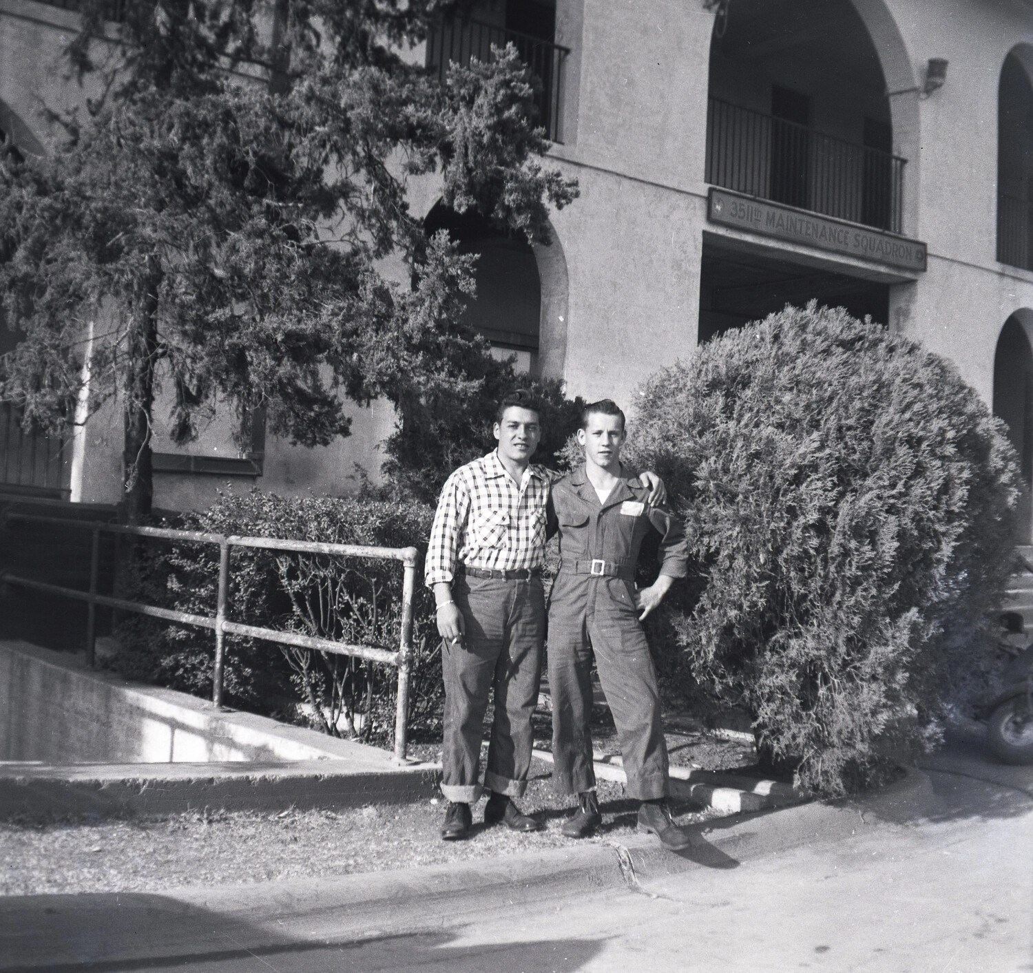 Two Men Posing Outside the 351st Maintenance Squadron Building