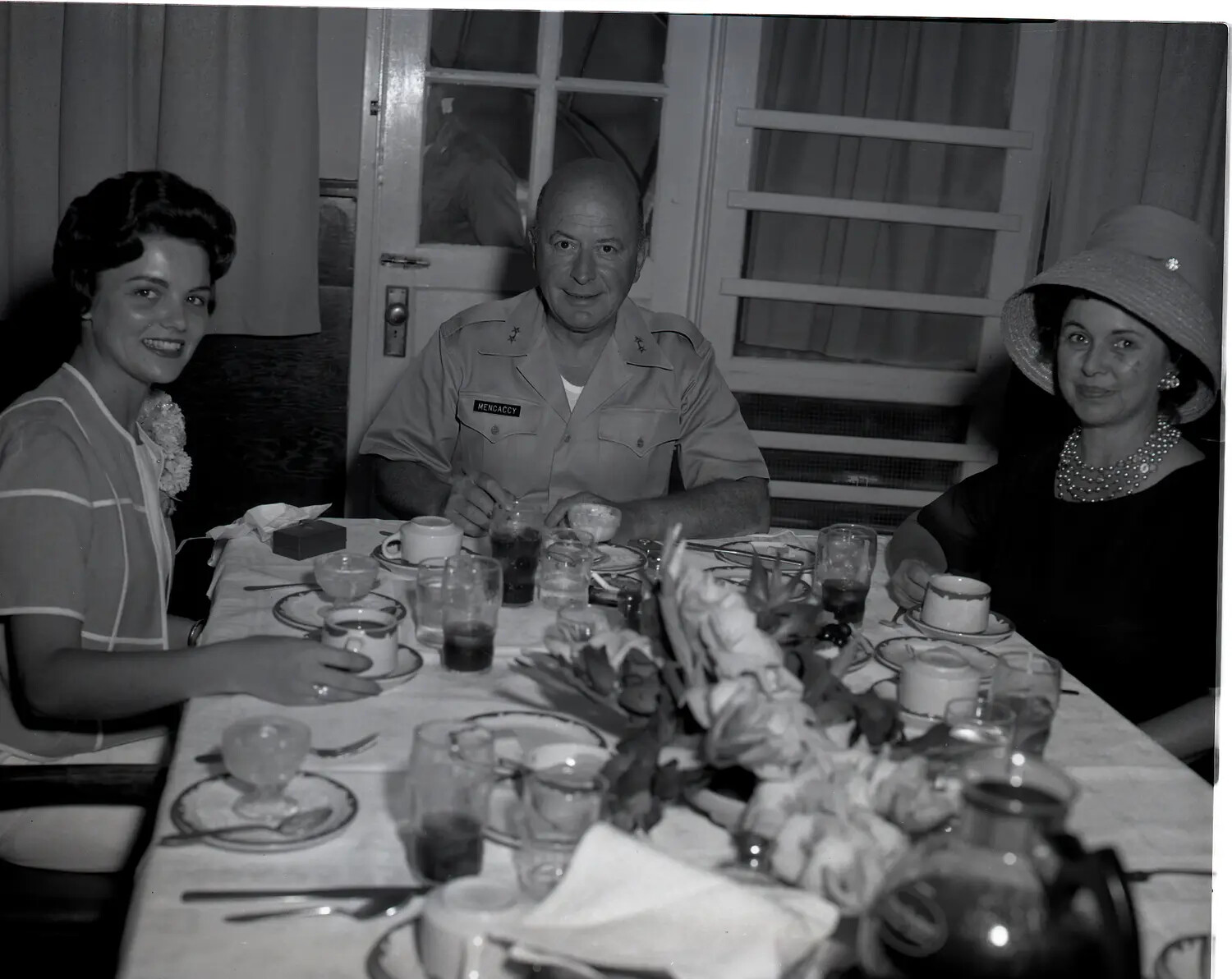 Maj. Gen. Fernando C. Mencaccy Seated with Guests at Reserve Officers' Social Function, c. early 1960s