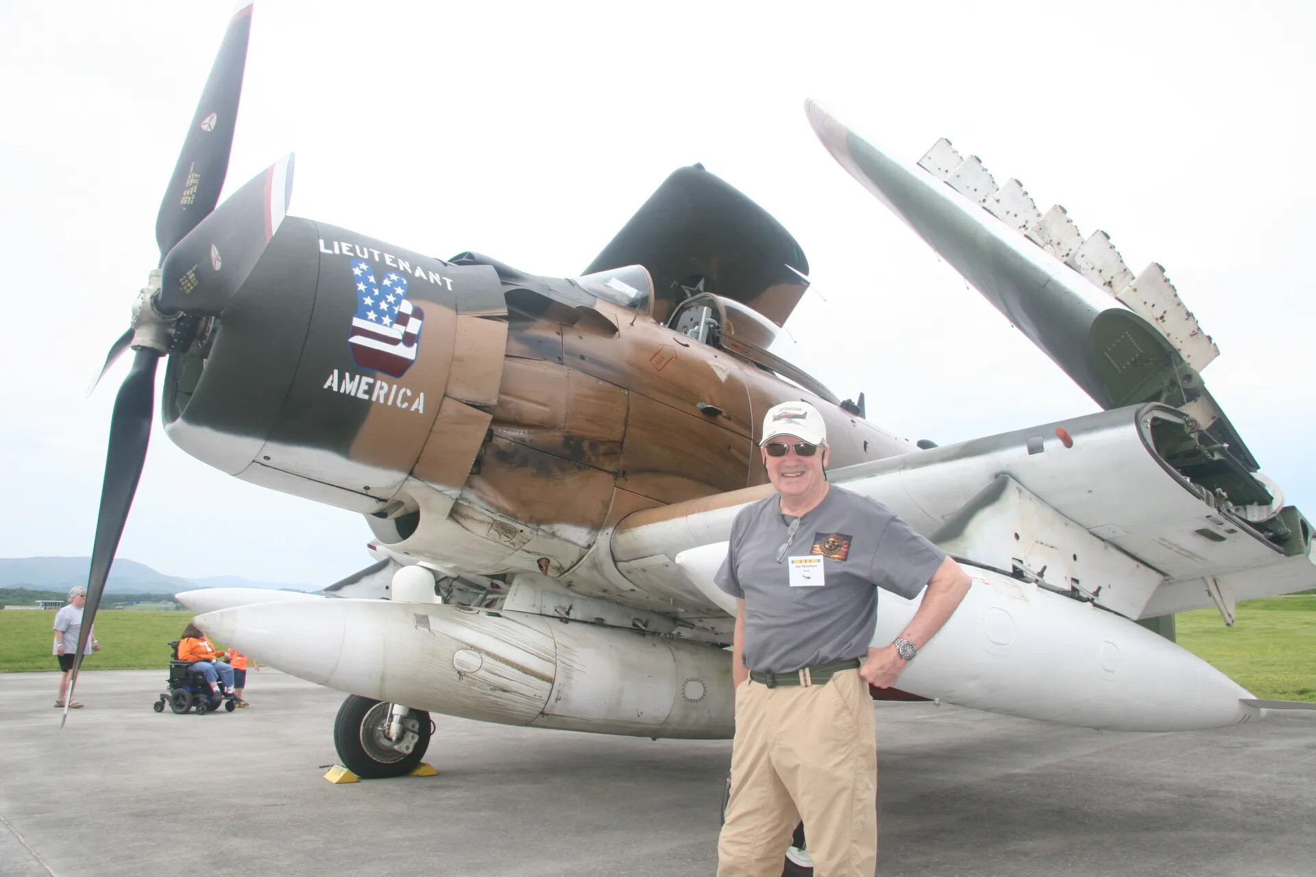 Visitor Poses with A-1 Skyraider "Lieutenant America" at Operation Tailwind Event, 2016