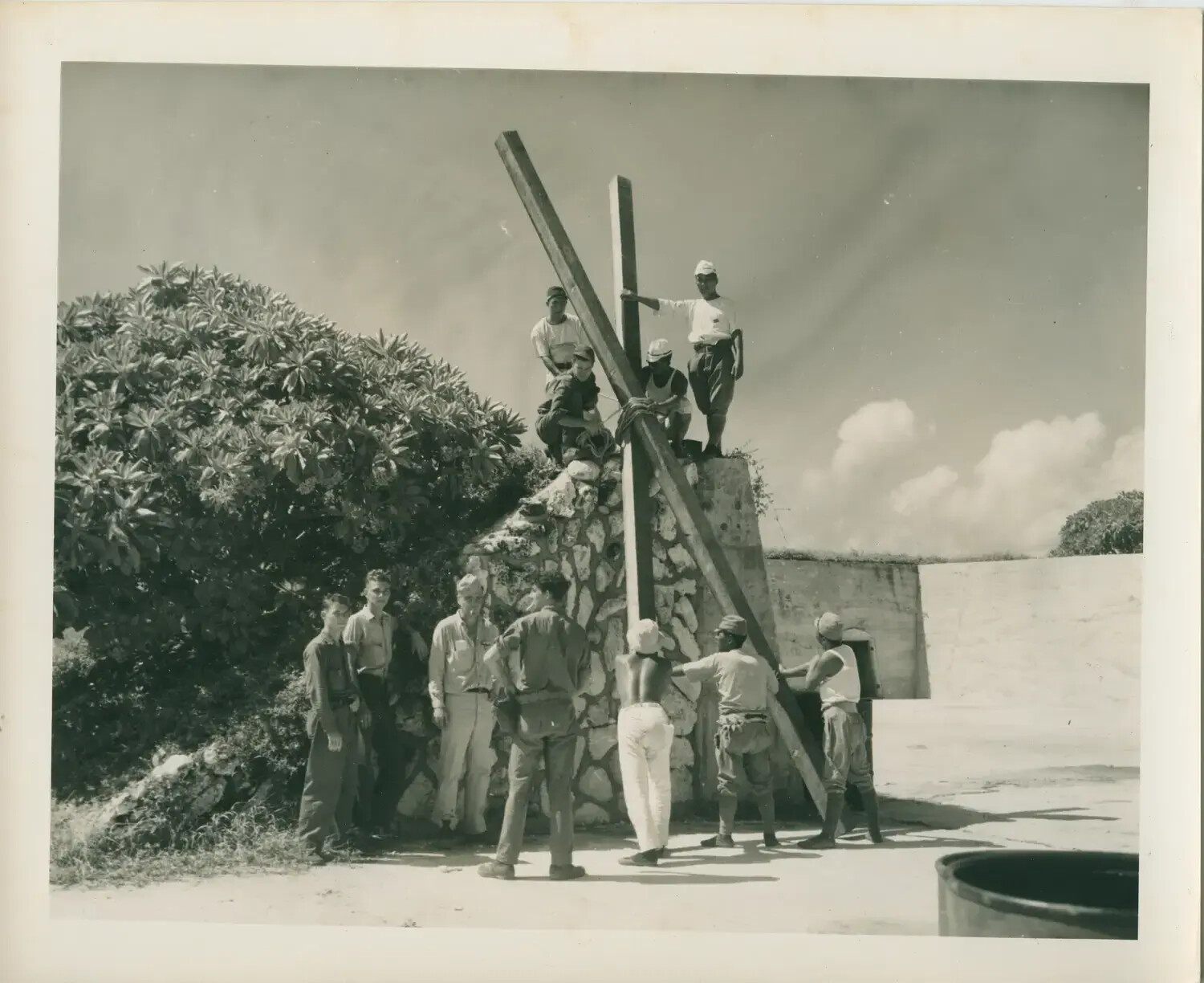 Sailors Erecting a Wooden Cross Atop a Coral-Block Monument - USS Petrof Bay (CVE-80) Collection