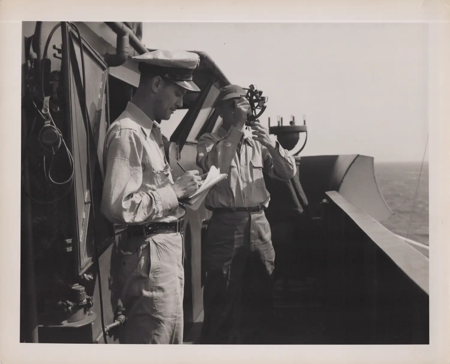 Naval Officers Taking a Sextant Sight on the Bridge Wing, WWII