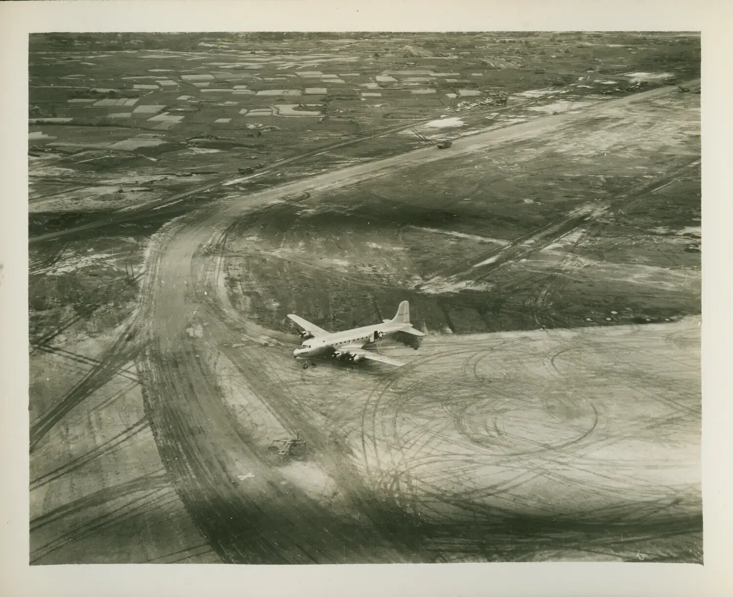 Douglas C-54 Skymaster on Airfield Ramp, Aerial View, Pacific Theater, WWII