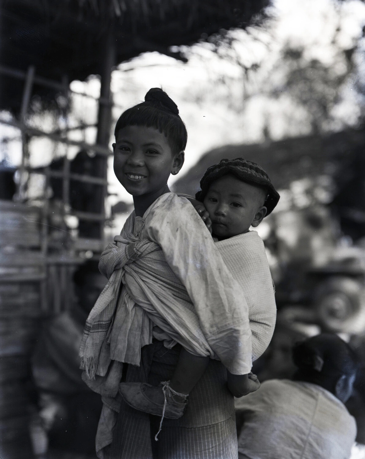 Young Burmese Girl Carrying Infant, China-Burma-India Theater, WWII