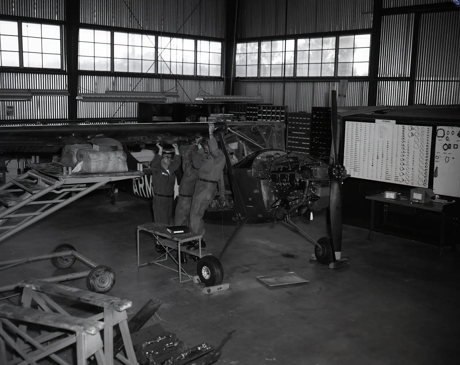 Interior of California Army National Guard Maintenance Hangar with Cessna L-19 Bird Dog Under Overhaul