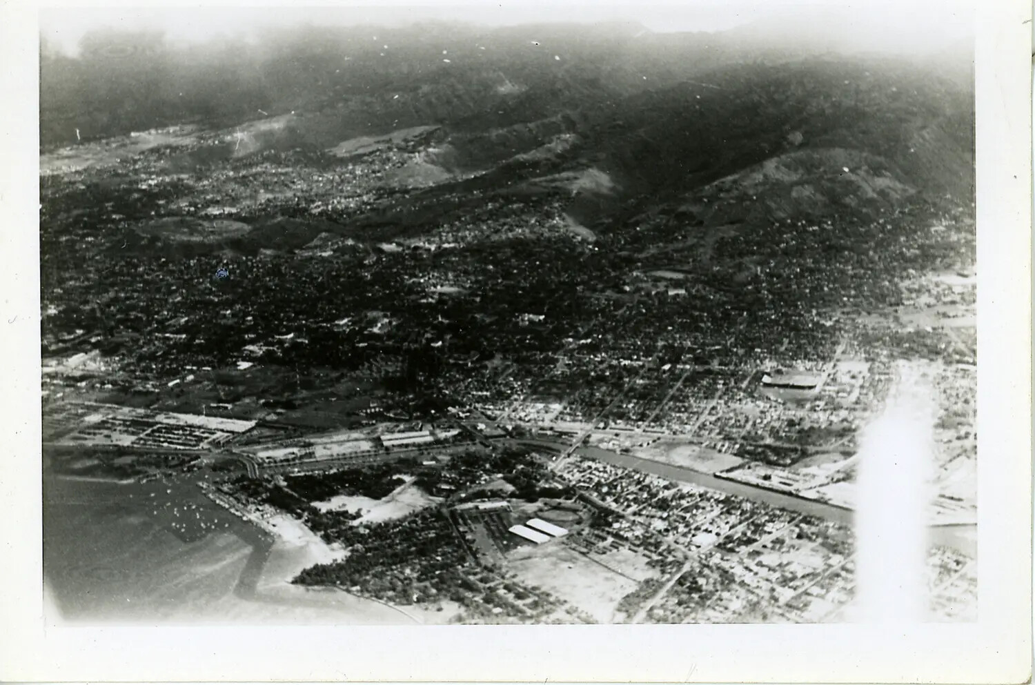 Aerial View of a Hawaiian Coastal City, Likely Honolulu, Oahu — WWII Era