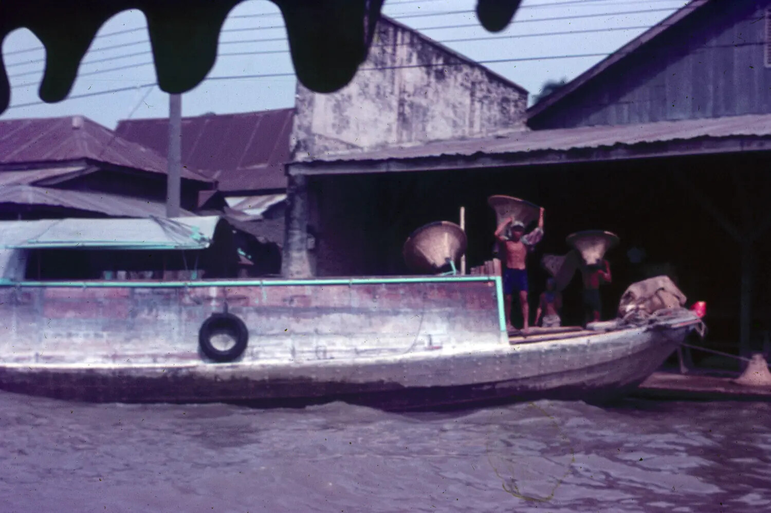 Vietnamese Cargo Boat and Dockworkers Along a Canal, Vietnam War Era
