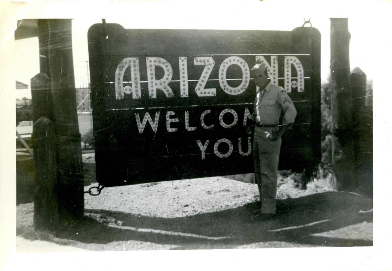 Soldier Posing at 'Arizona Welcomes You' Roadside Sign, WWII Era