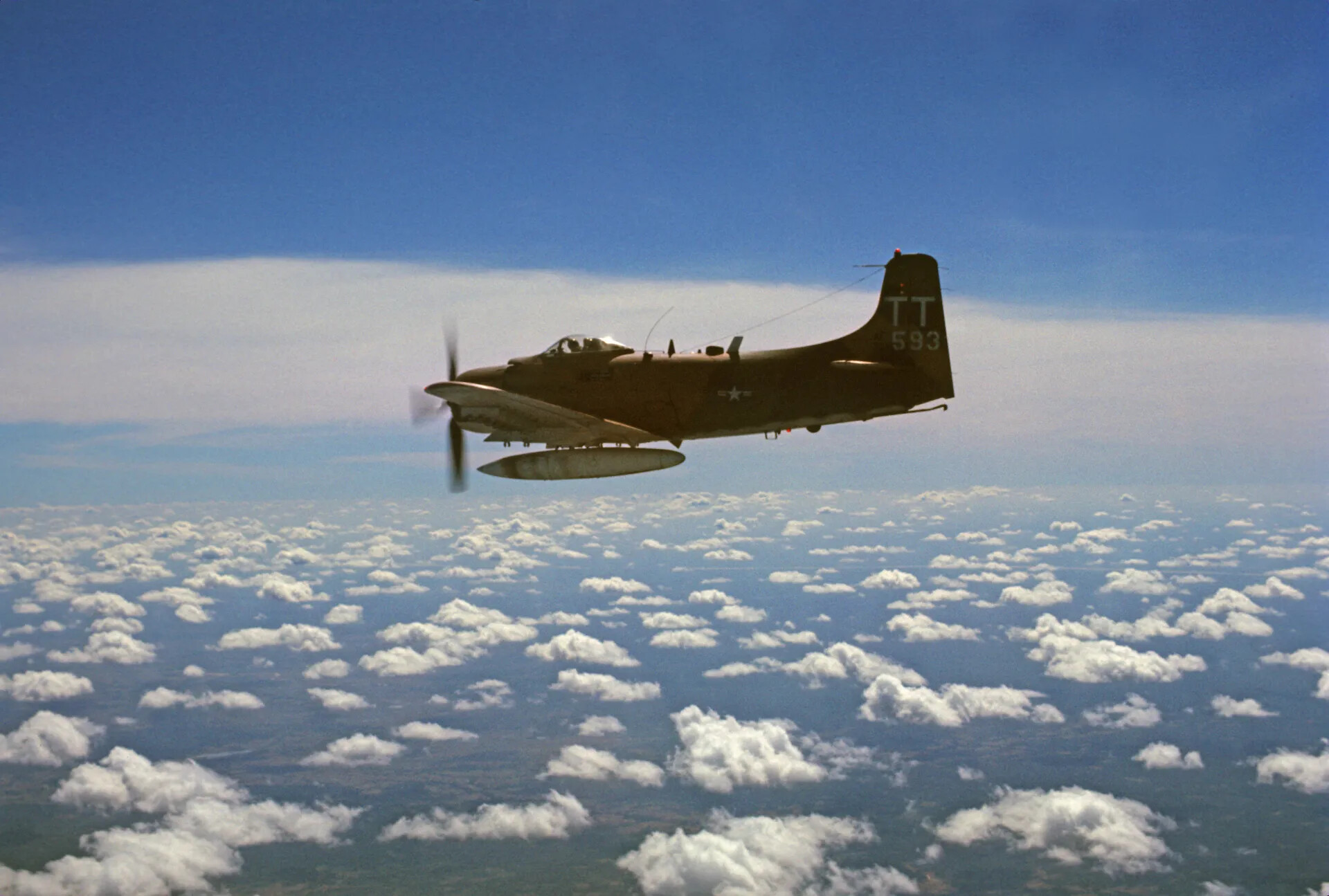 Air Commando A-1 Skyraider "TT-593" in Flight Above Clouds, Southeast Asia, December 1969