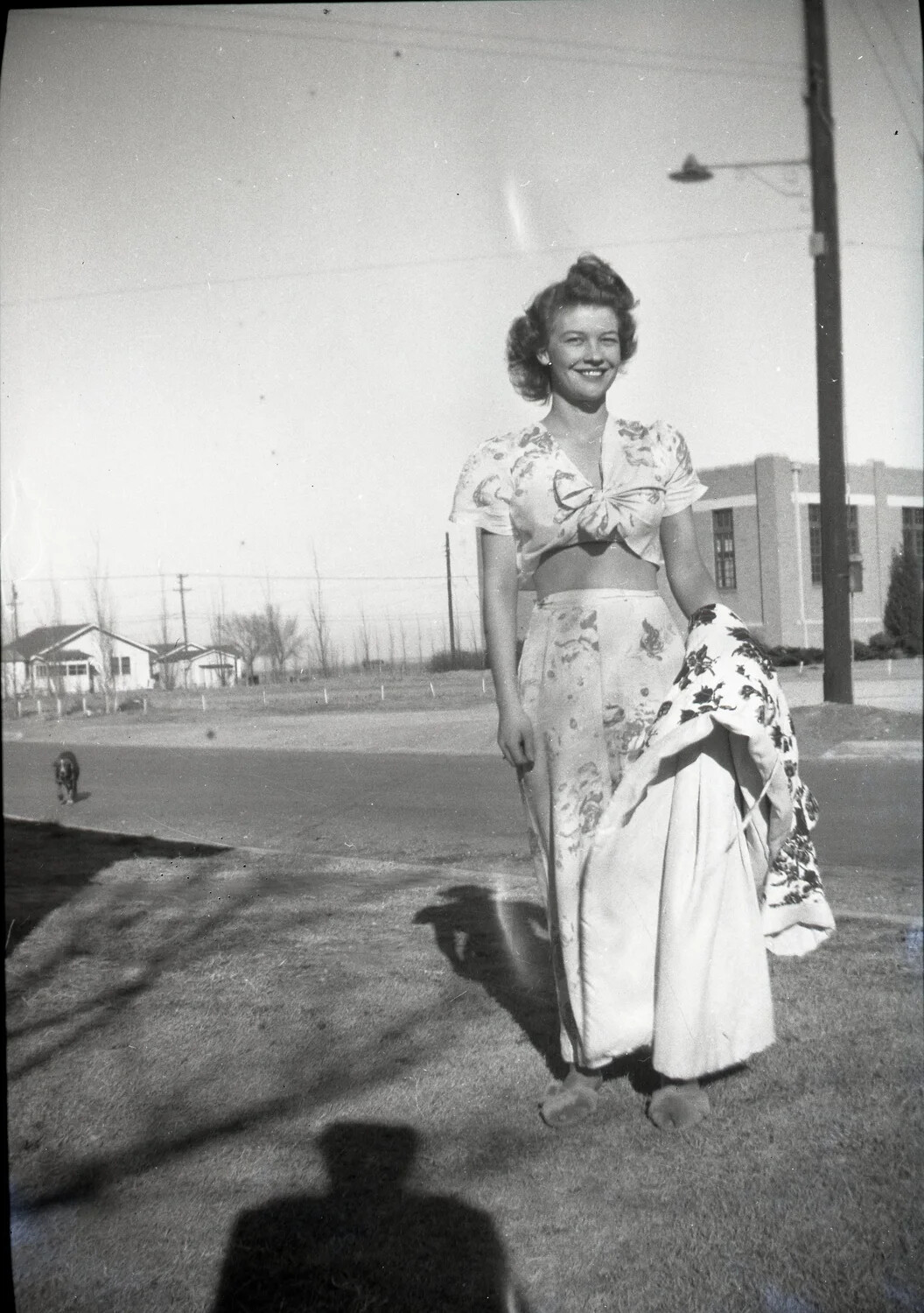 Woman in Floral Two-Piece Outfit on Residential Street, WWII-Era Home Front Snapshot