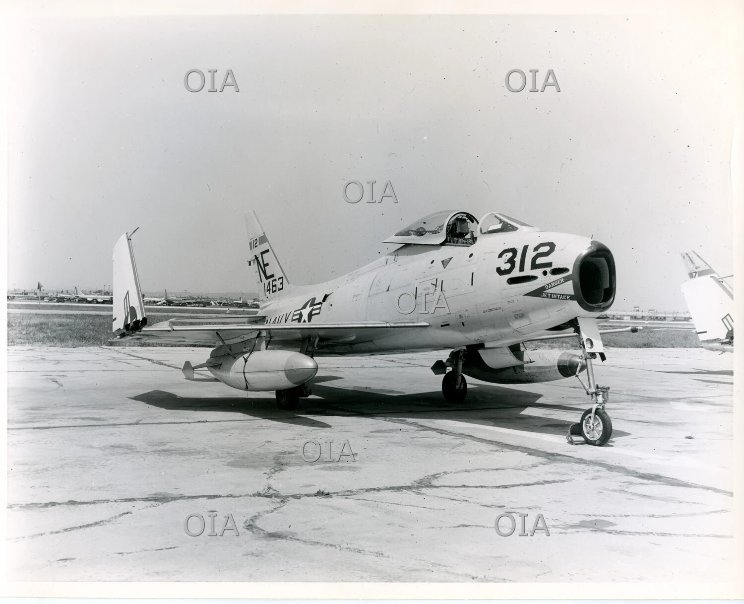 U.S. Navy Swept-Wing Jet Fighter (FJ-3/FJ-4 Fury type), Tail Code NE, Side Number 312, on Ramp