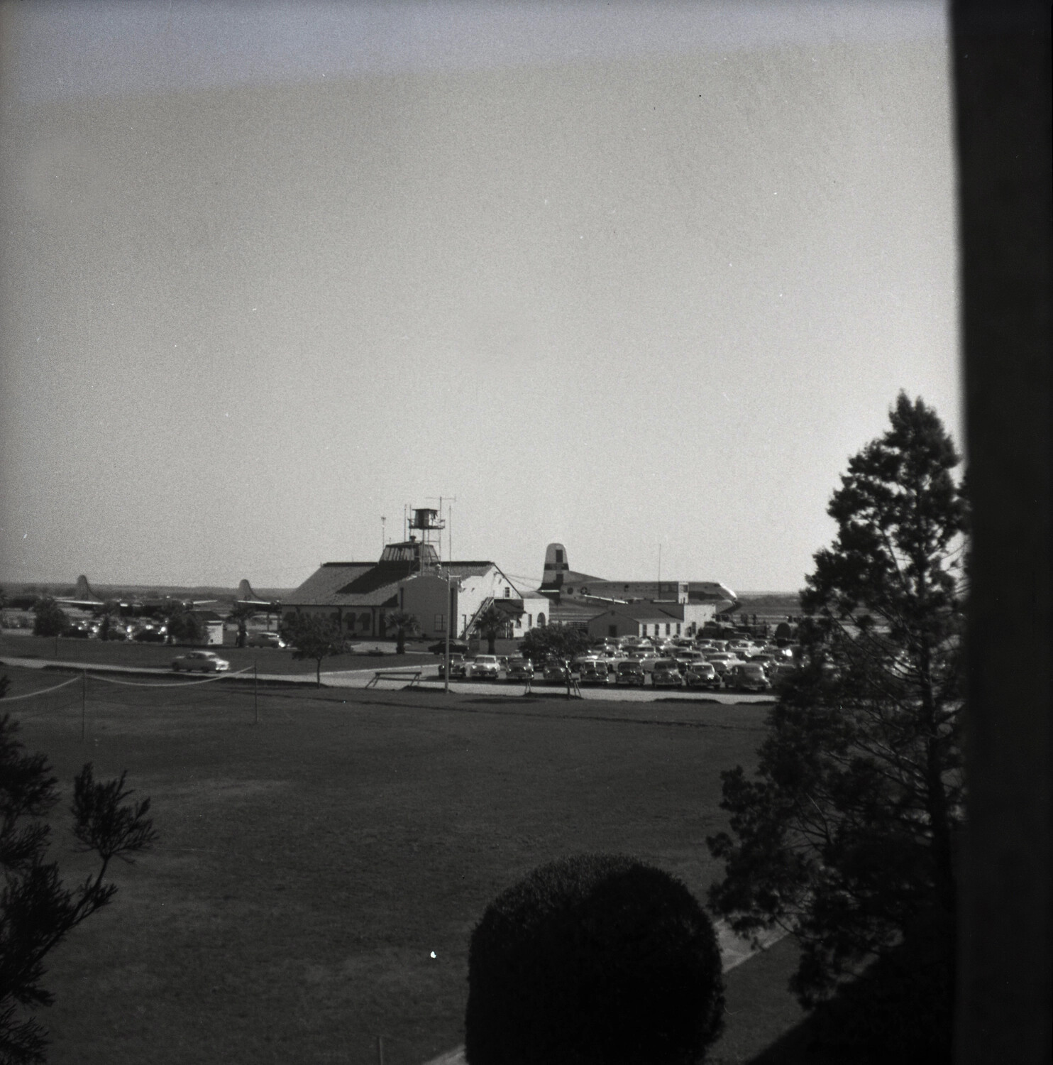 Elevated View of Flight Line with Transport Aircraft and Control Tower