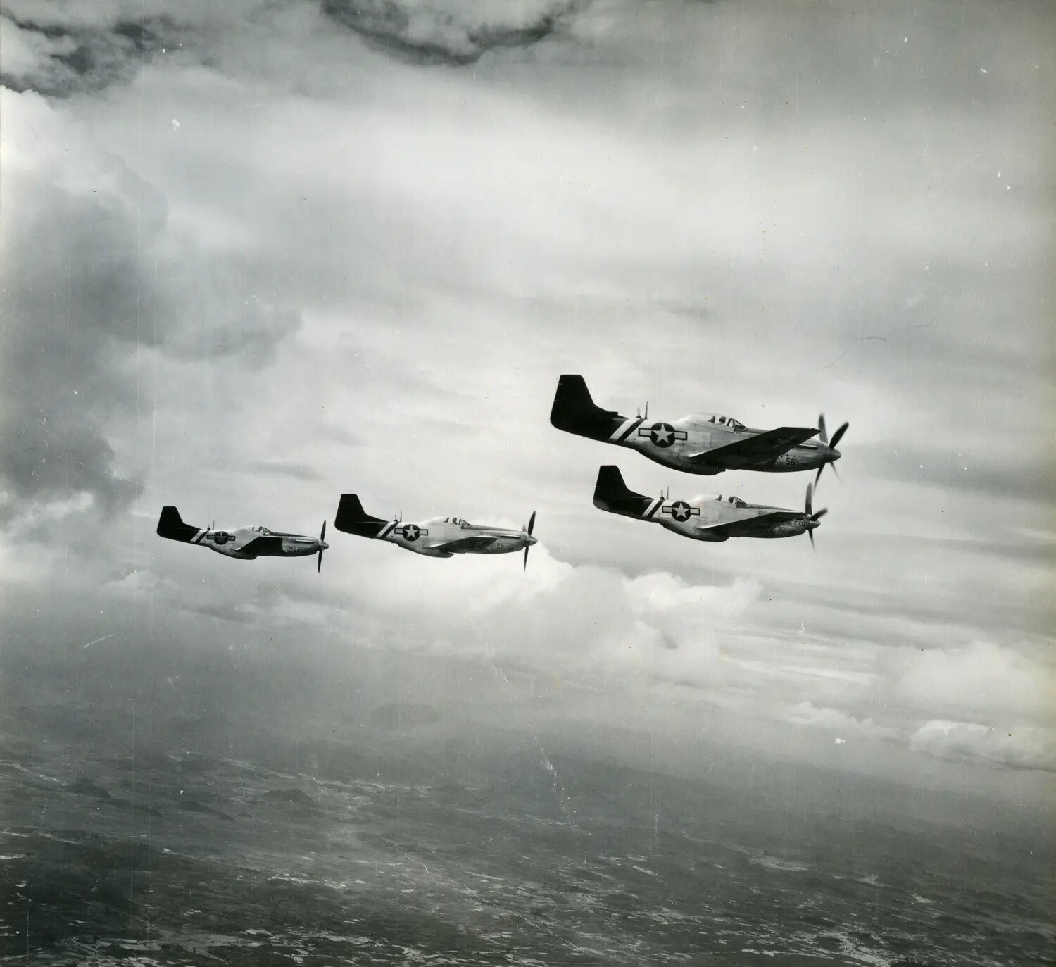 Formation of Four North American P-51 Mustang Fighters Over Cloud Cover, CBI Theater, WWII