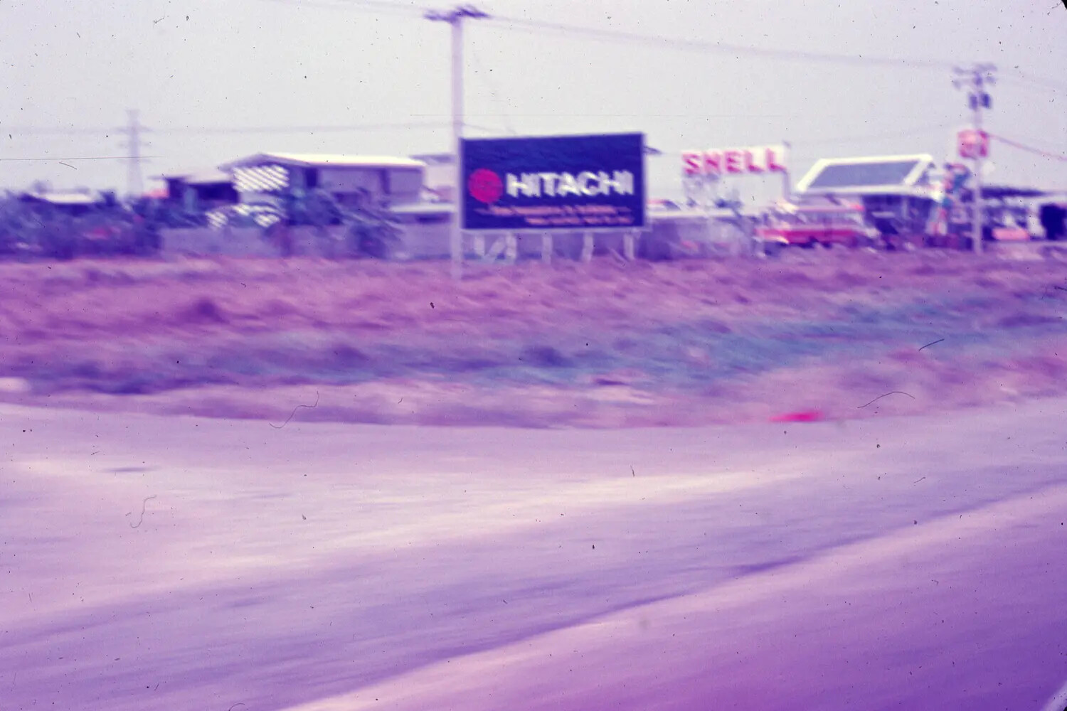 Roadside Commercial Signage Near an Air Base, South Vietnam, 1965