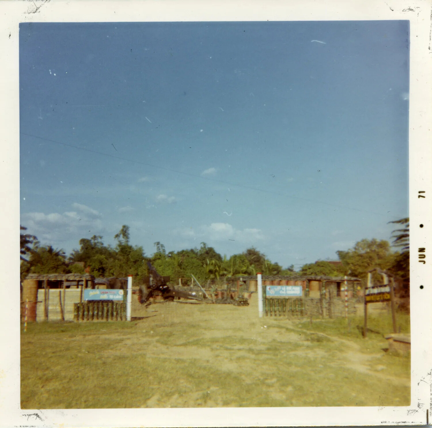 Entrance Gate and Sandbagged Bunkers at a U.S. Military Compound, Vietnam, 1971