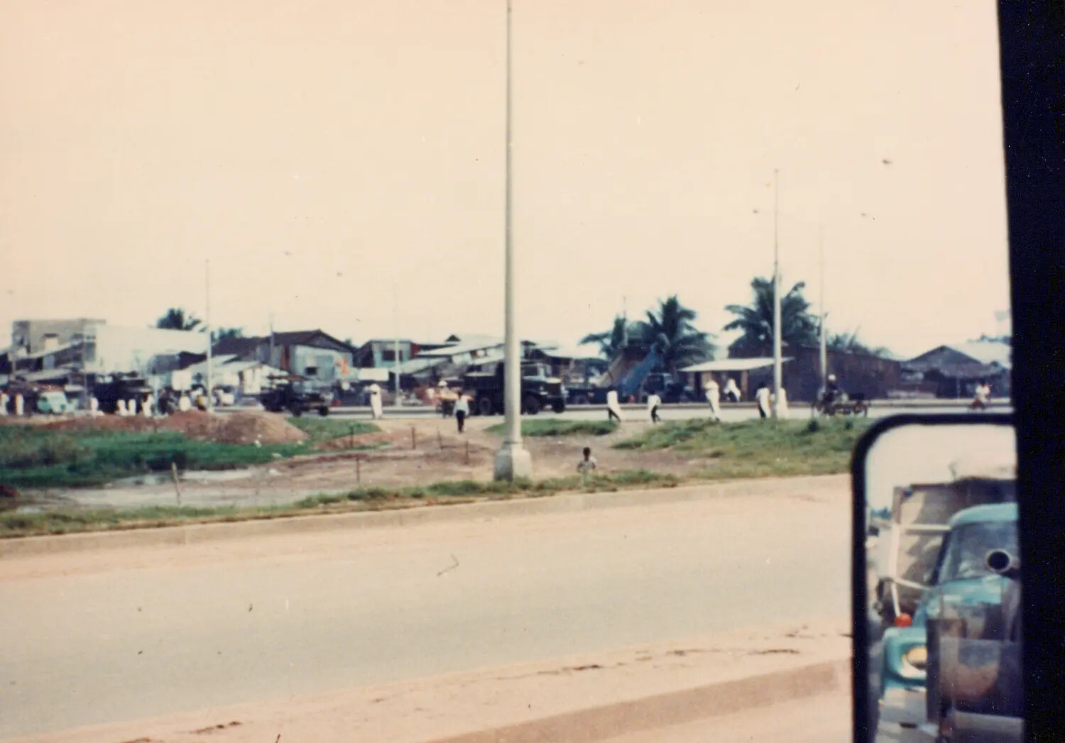 Convoy View of Village Roadside Near Cu Chi, South Vietnam, 1967