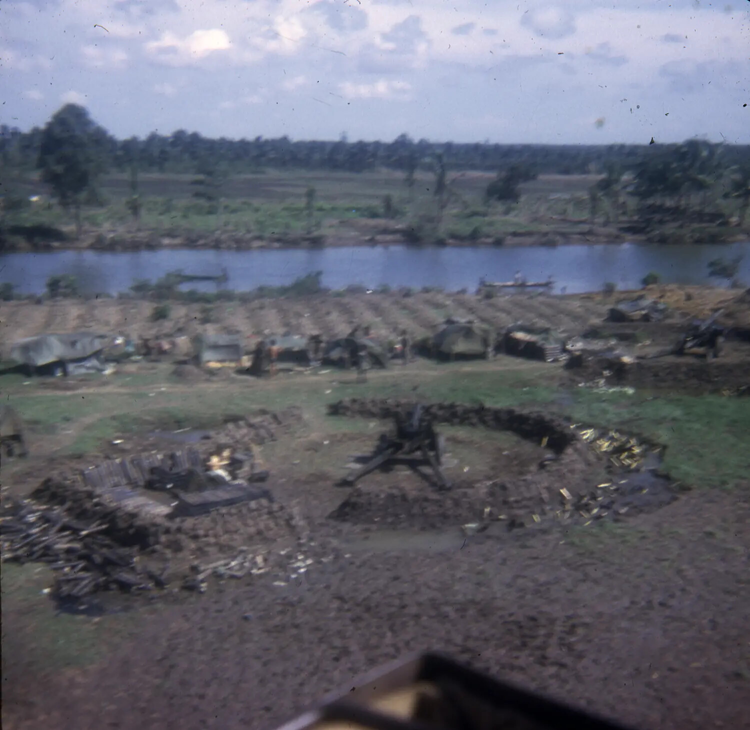 Aerial View of Vietnam War Firebase with Sandbagged Weapon Emplacements Along River, 35mm Slide Collection