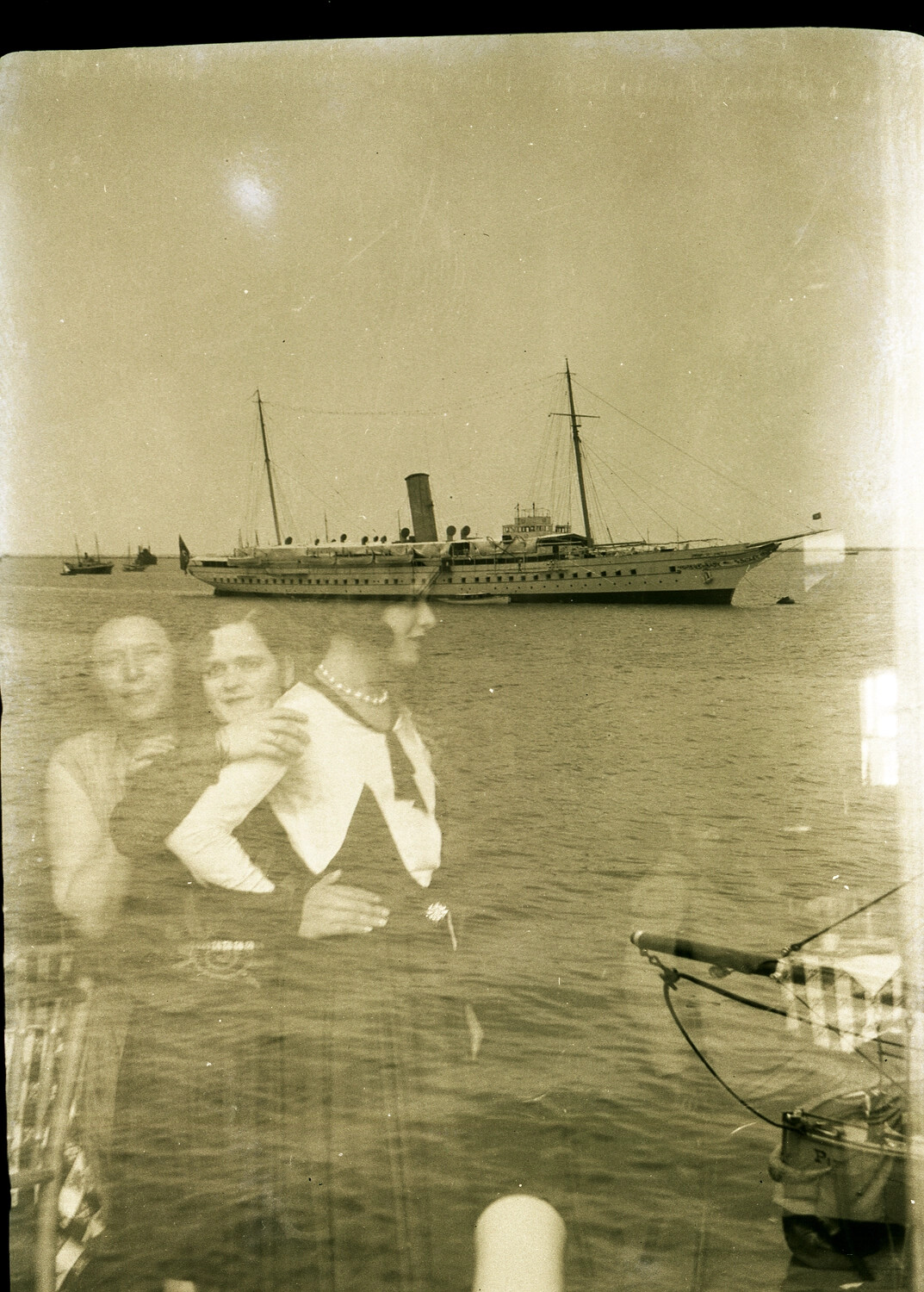 Double-Exposed Photograph: Anchored Steam Vessel in Chinese Harbor with Superimposed Portrait of Two Women, circa 1930s