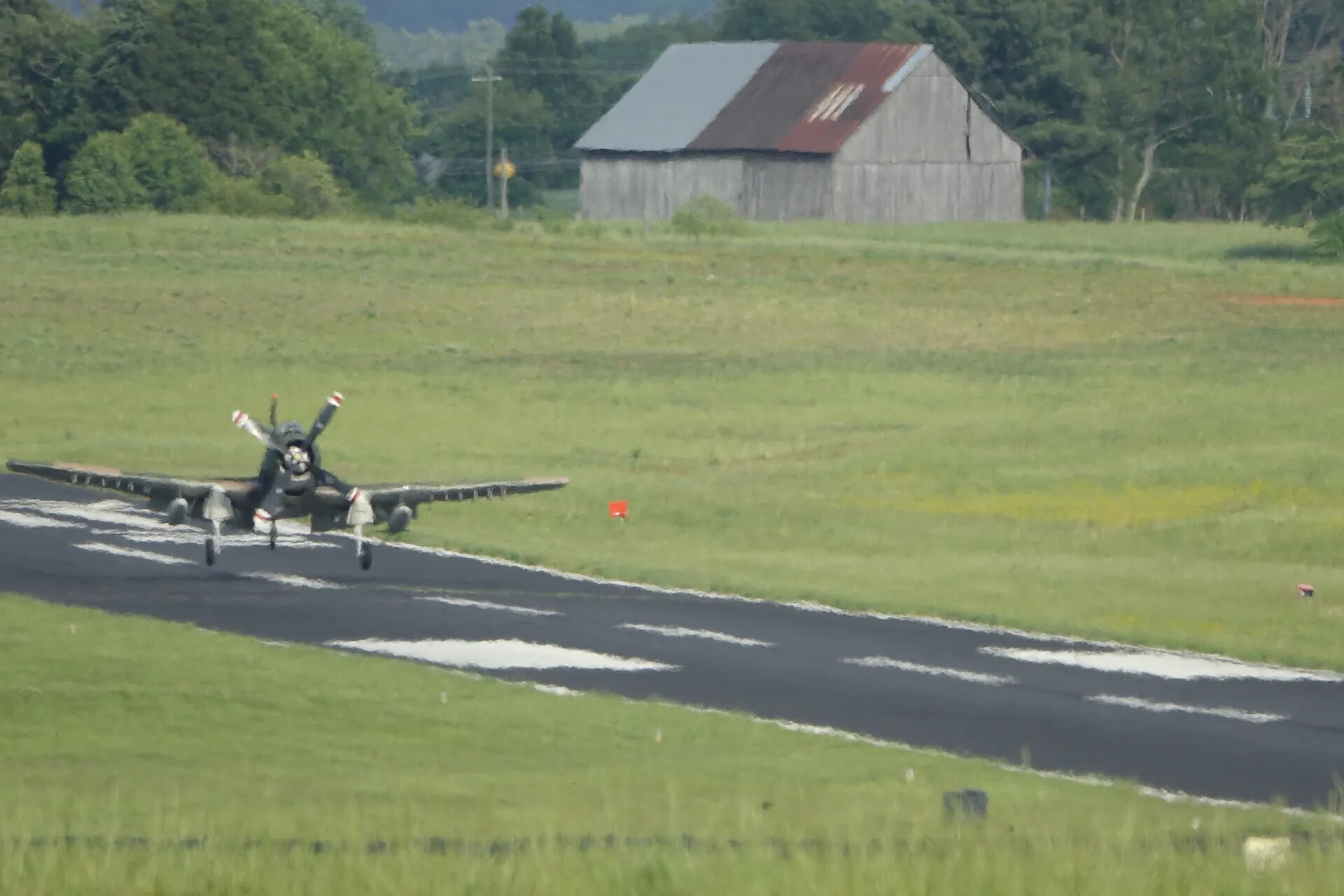 A-1 Skyraider Touch-and-Go with Weathered Barn Backdrop