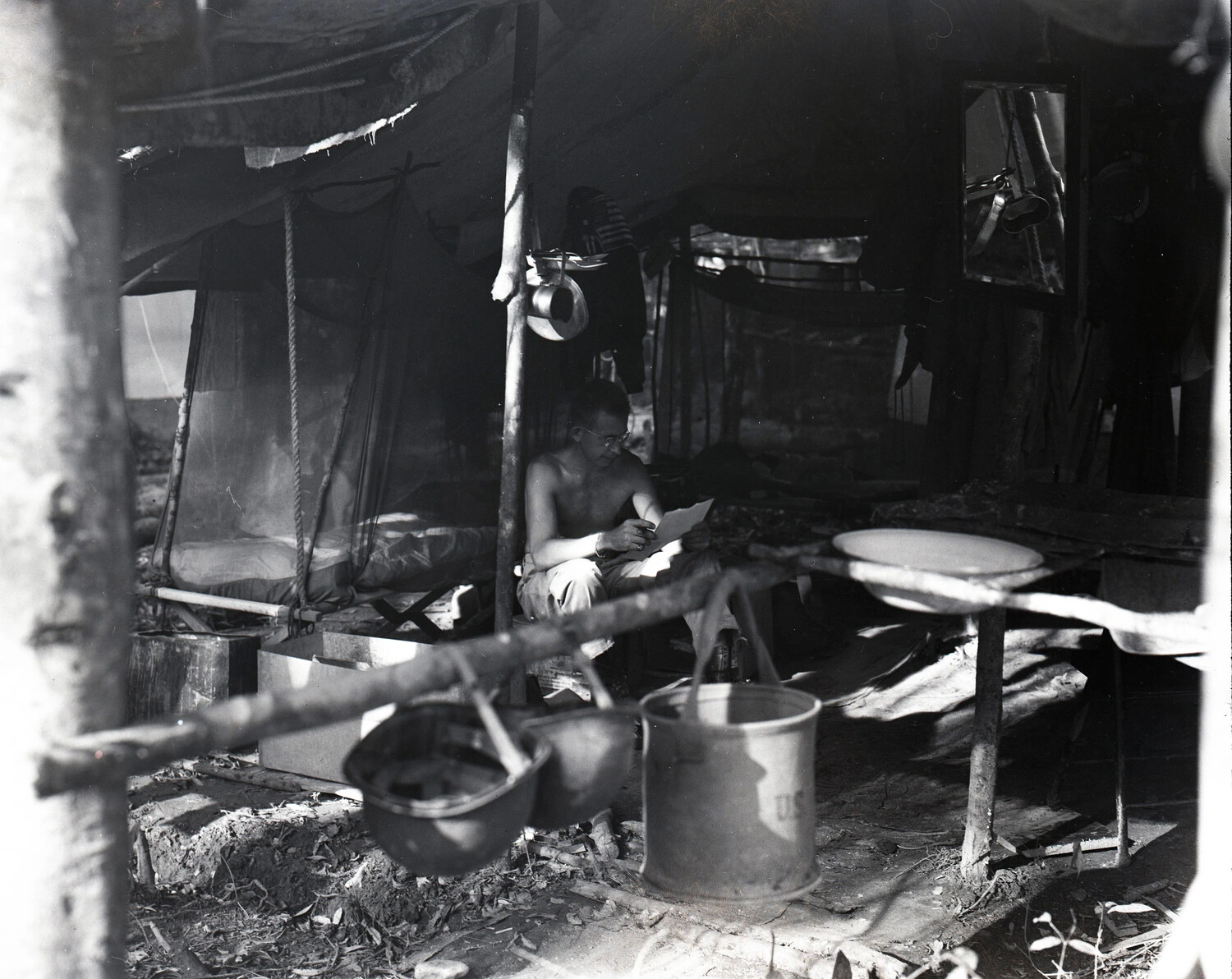 Serviceman Reading Letter in Tent Quarters, CBI Theater Field Camp, WWII
