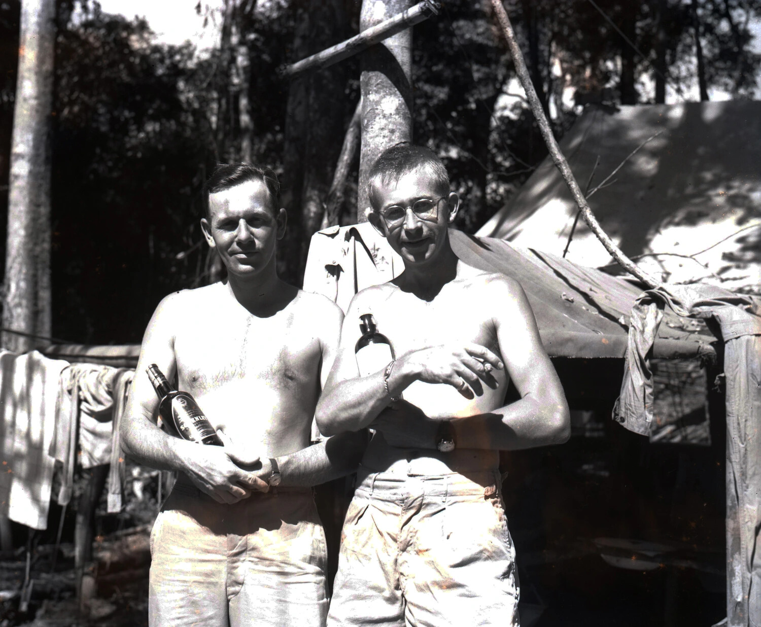 Two Shirtless Servicemen with Liquor Bottles at Jungle Camp, Burma, WWII CBI Theater