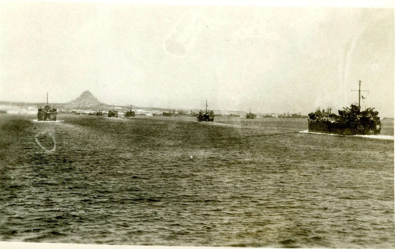 Landing Craft Convoy Off a Pacific Island Coastline, Possibly Ie Shima, 1945