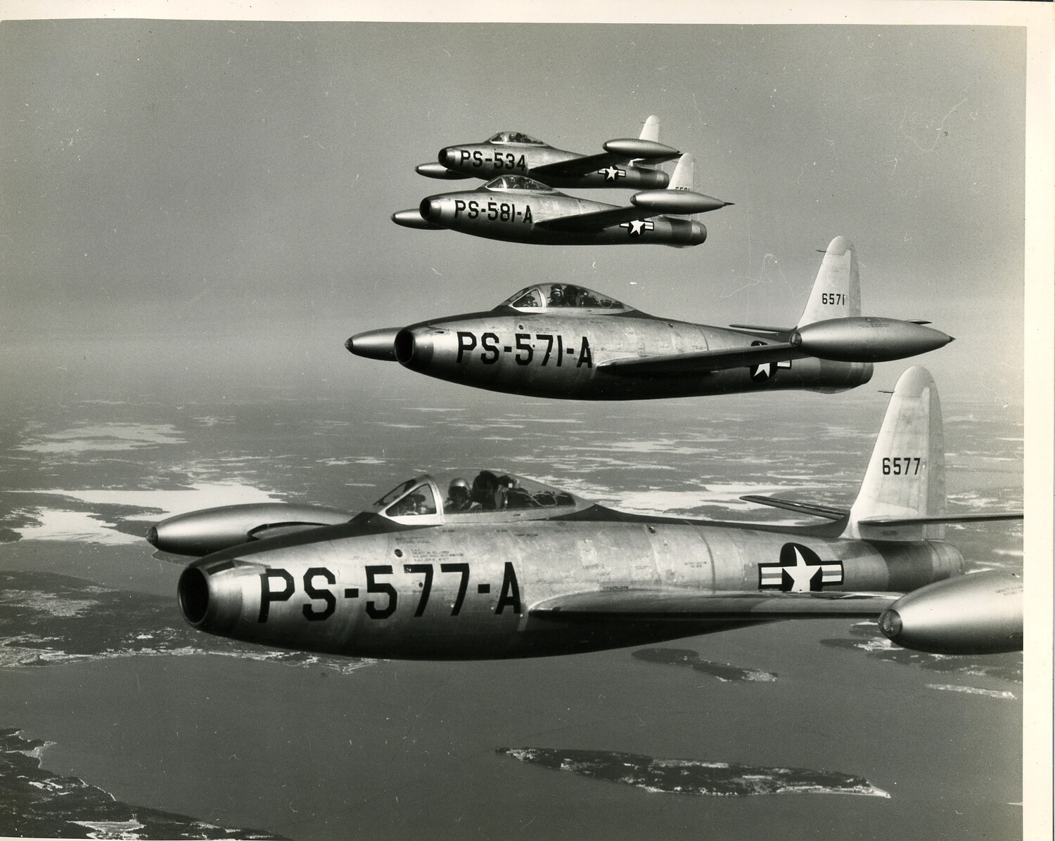 Formation of Four Lockheed T-33A Shooting Star Jet Trainers in Flight
