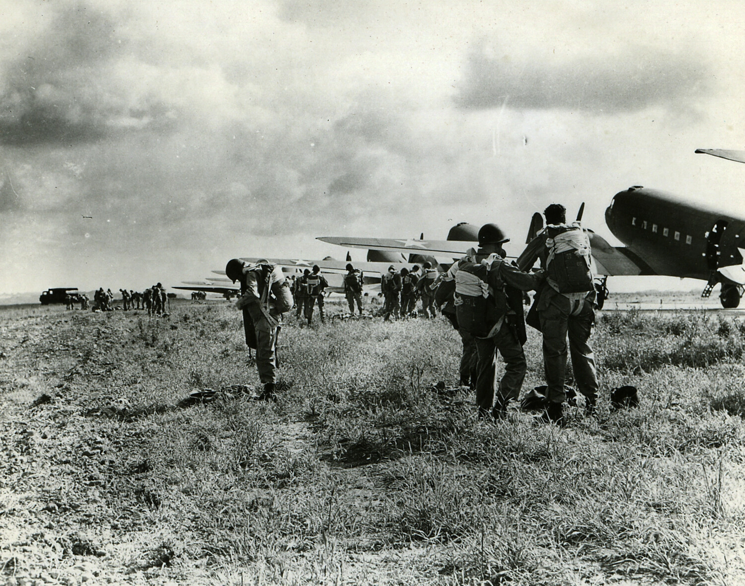 Paratroopers Marshalling and Boarding C-47 Transport Aircraft at Departure Airfield