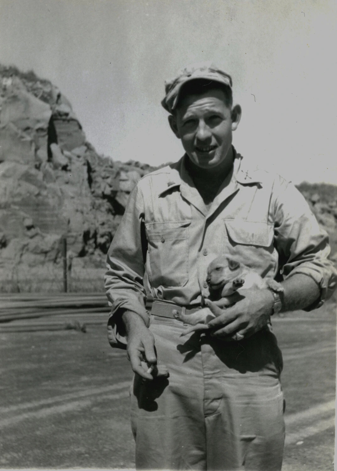 US Marine with Pet Piglet Amid Volcanic Terrain, Iwo Jima (5th Marine Division, WWII, 1945)