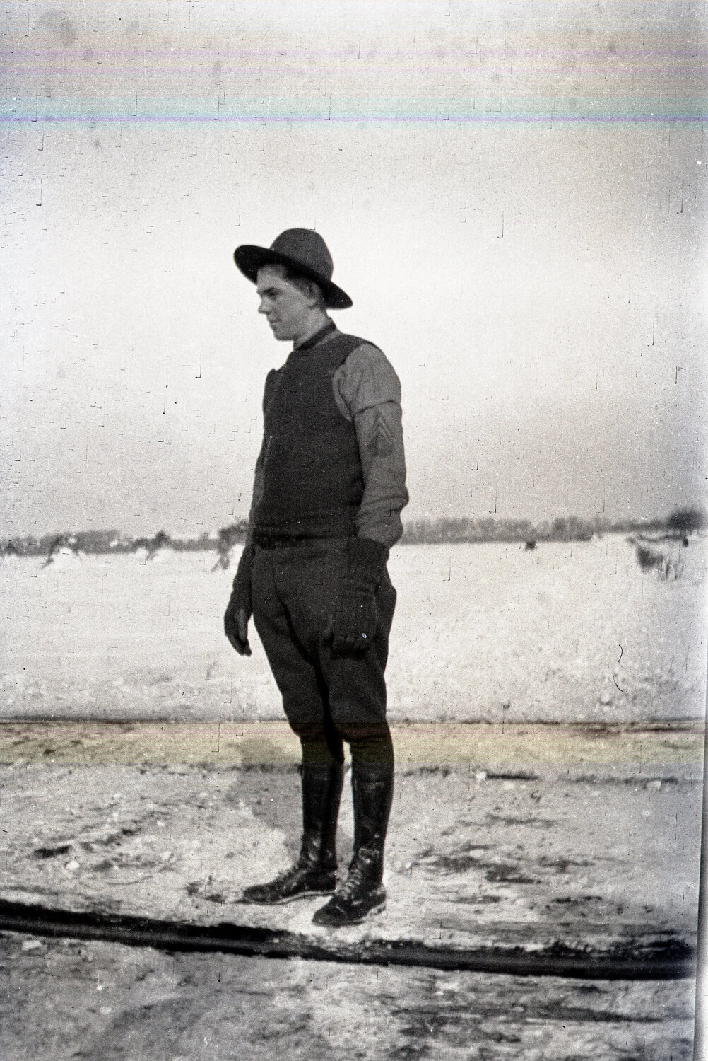 WWI-Era U.S. Army Sergeant Standing in Snow-Covered Field, Profile Portrait