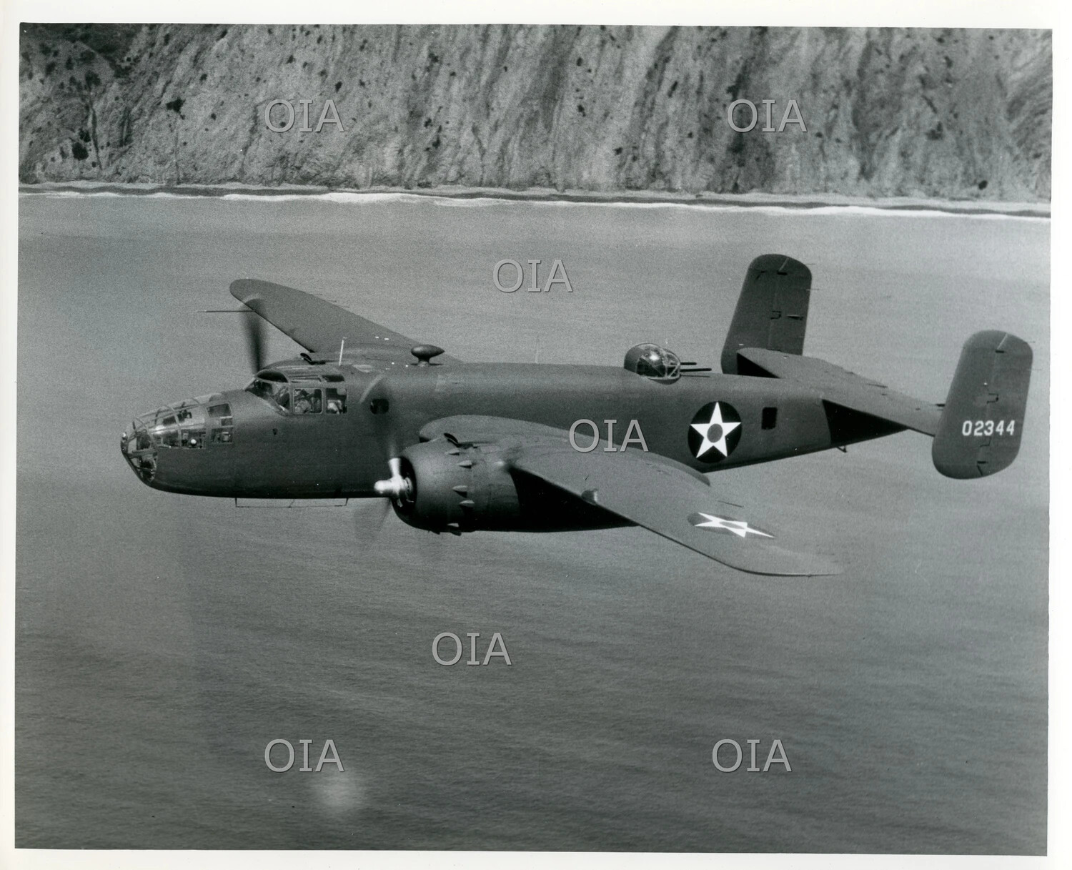 North American B-25 Mitchell Bomber Banking Over Coastal Cliffs, Serial 02344 (c. 1942-1943)