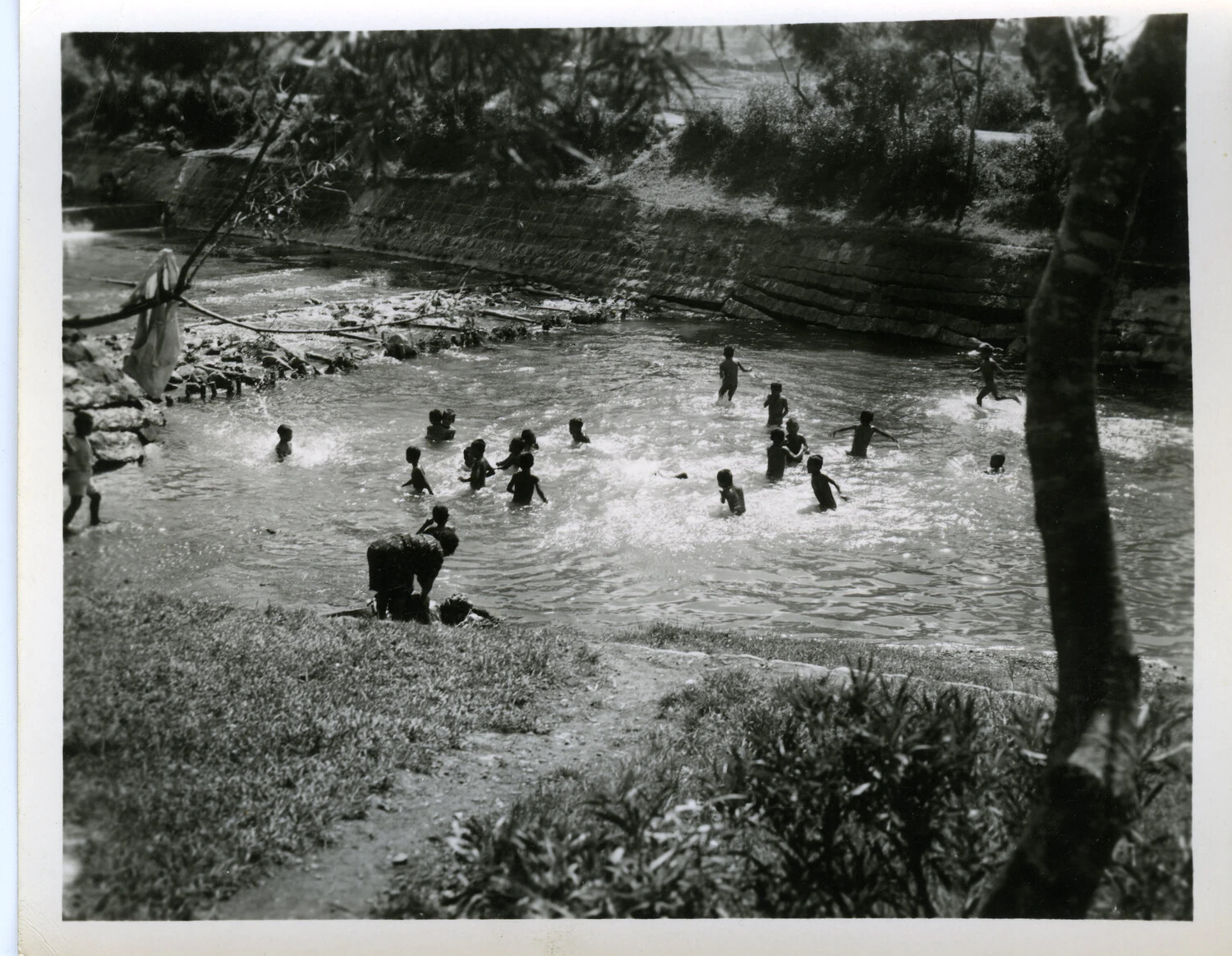 Okinawan Children Swimming in a Stone-Lined River, World War II Era