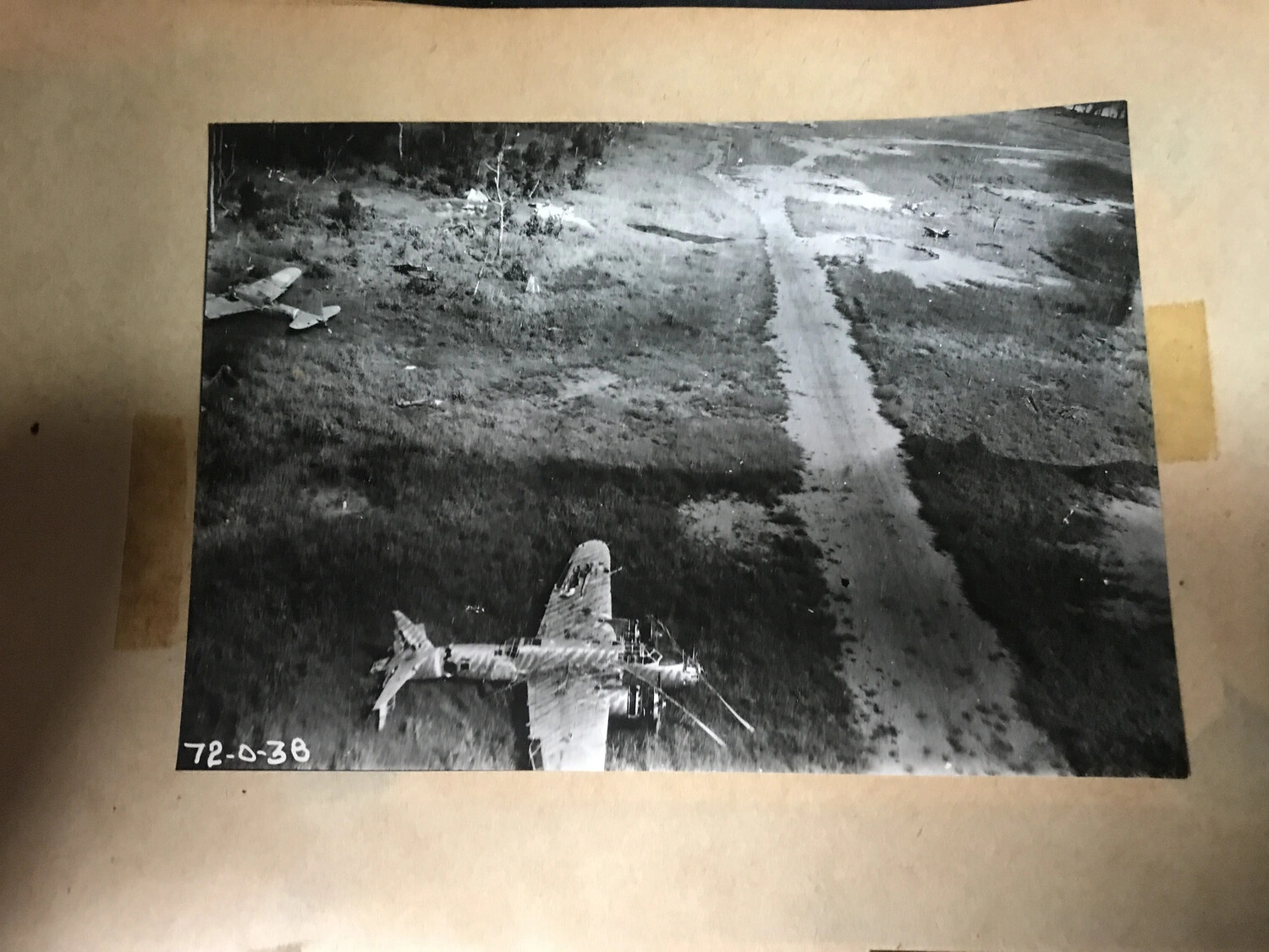 Wrecked Japanese Bomber and Fighter Aircraft, Airfield Dispersal Area, New Guinea