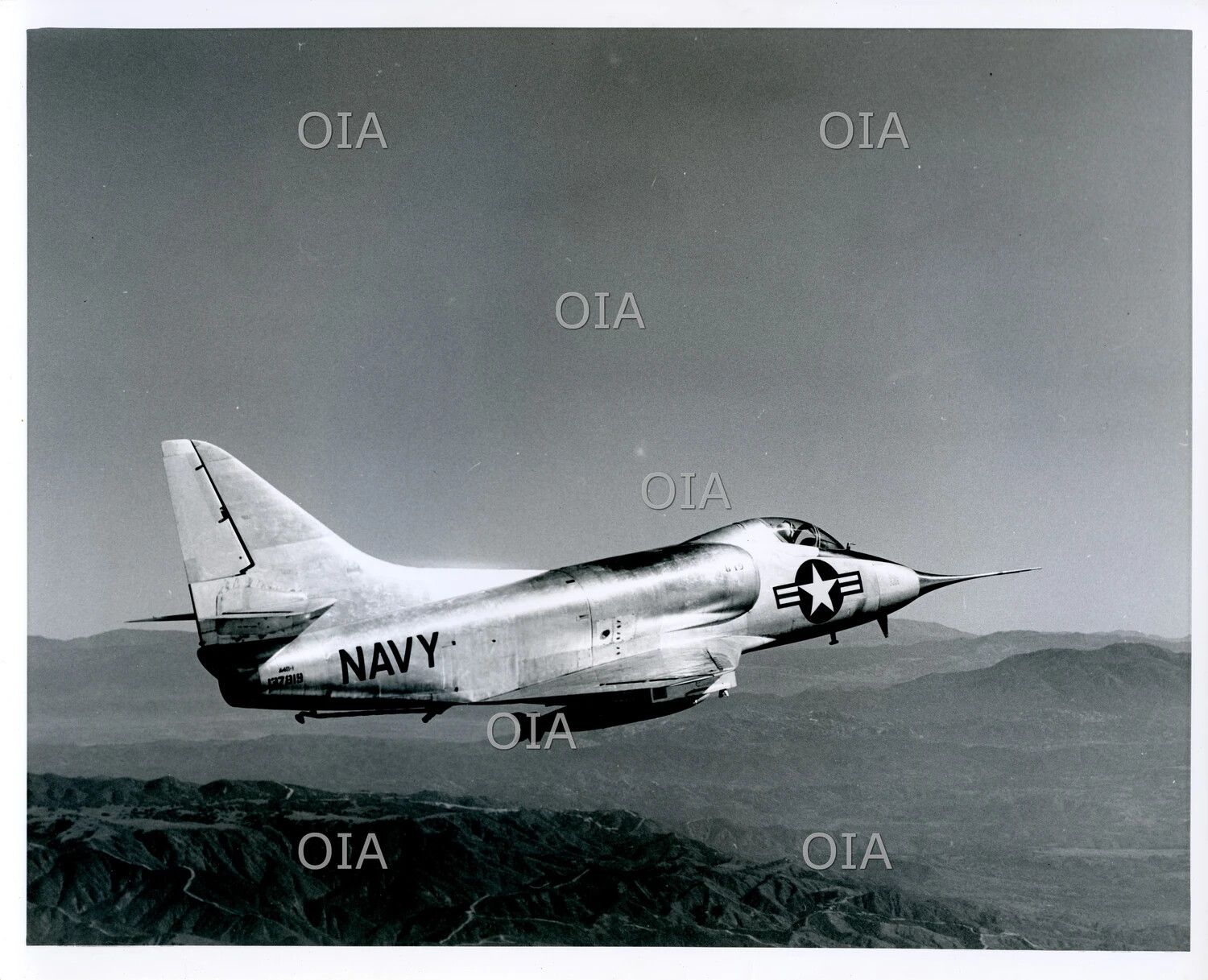 Douglas A4D-1 Skyhawk in Flight Over Mountainous Terrain, U.S. Navy Test Photograph