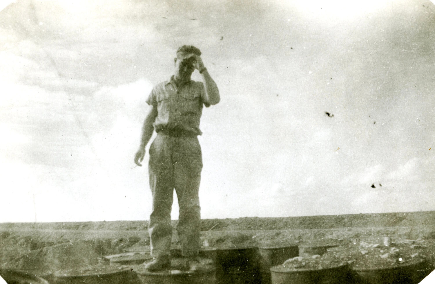 Marine Atop Stacked Fuel Drums, Iwo Jima Campaign, WWII