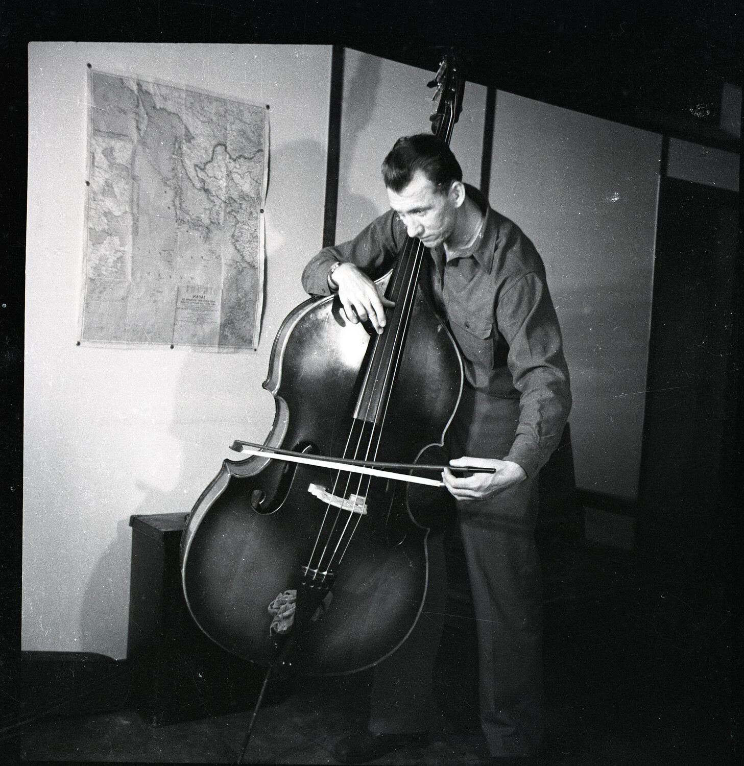 Military Bandsman Playing Double Bass, with Map of Japan, Post-WWII Era